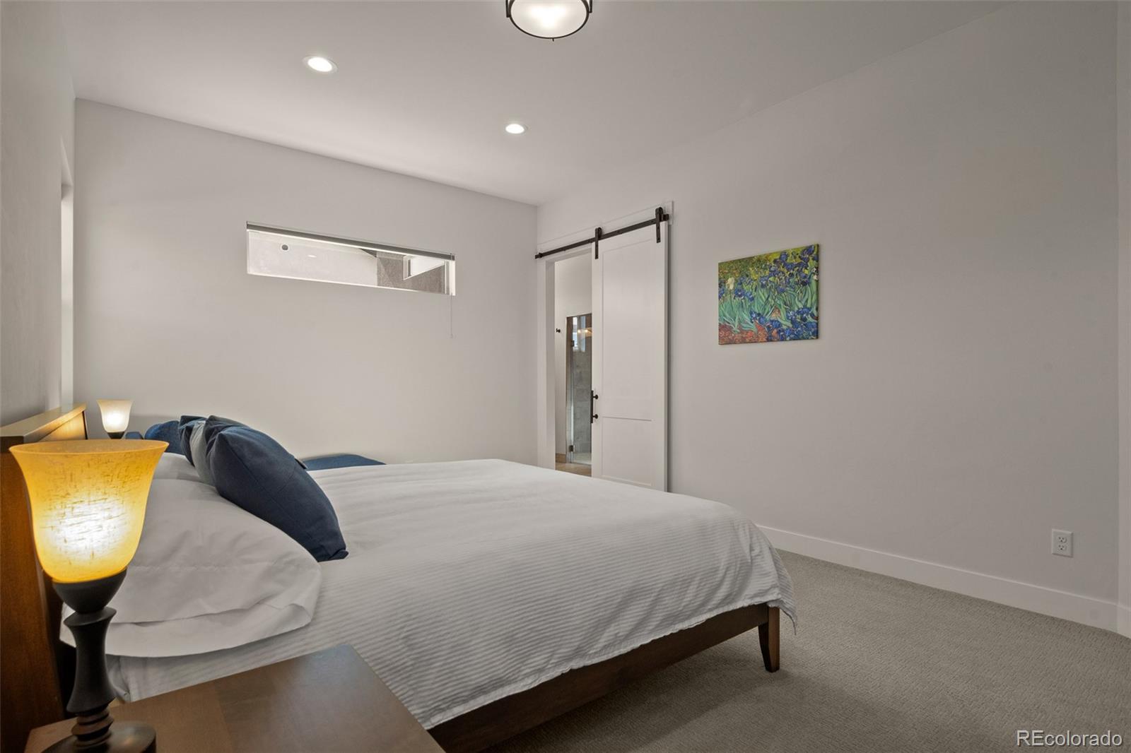 2287 Rock Valley Road Grand Junction, CO 81507 - Photo 15 of 32 a bedroom with a bed and painting on the wall