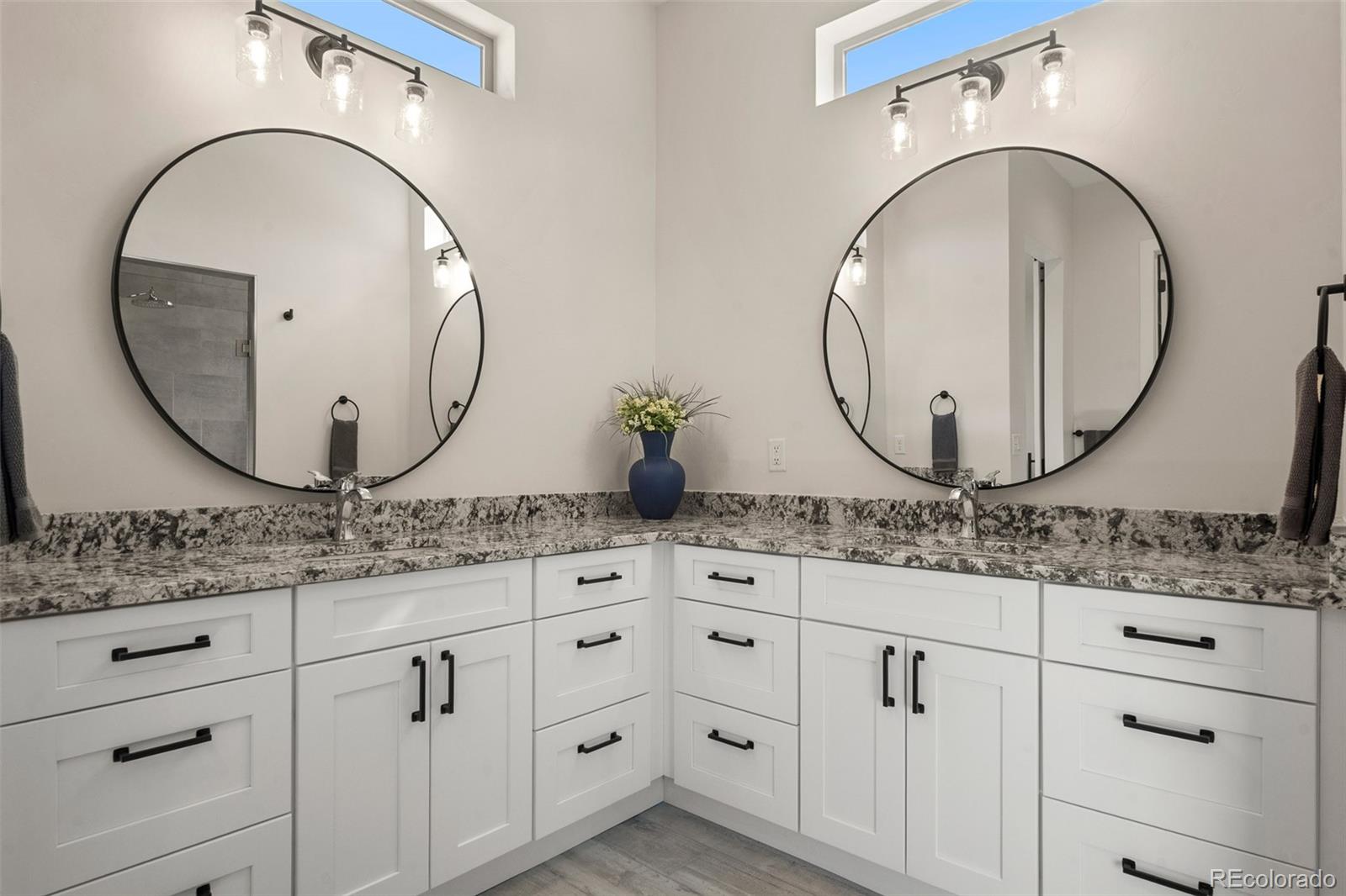 2287 Rock Valley Road Grand Junction, CO 81507 - Photo 16 of 32 a bathroom with a granite countertop sink mirror and vanity