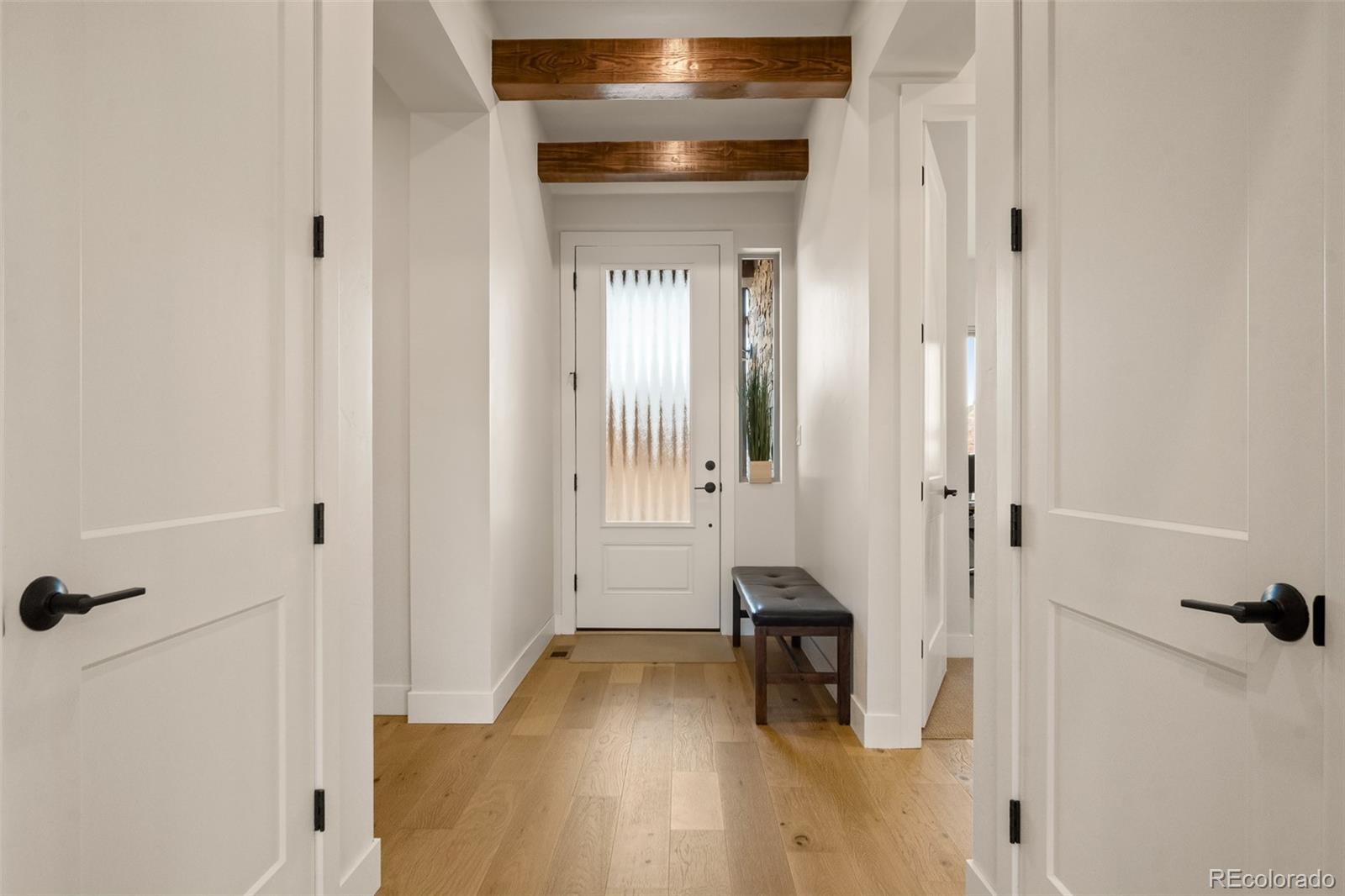 2287 Rock Valley Road Grand Junction, CO 81507 - Photo 19 of 32 a view of a room with wooden floor and a bathroom