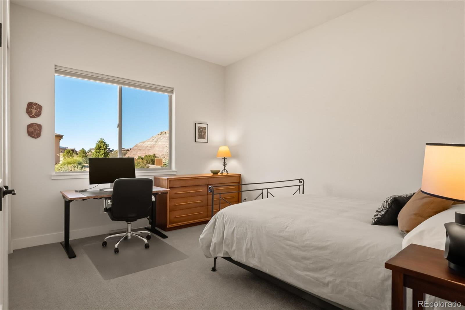 2287 Rock Valley Road Grand Junction, CO 81507 - Photo 20 of 32 a bedroom with a bed a chair and a large window