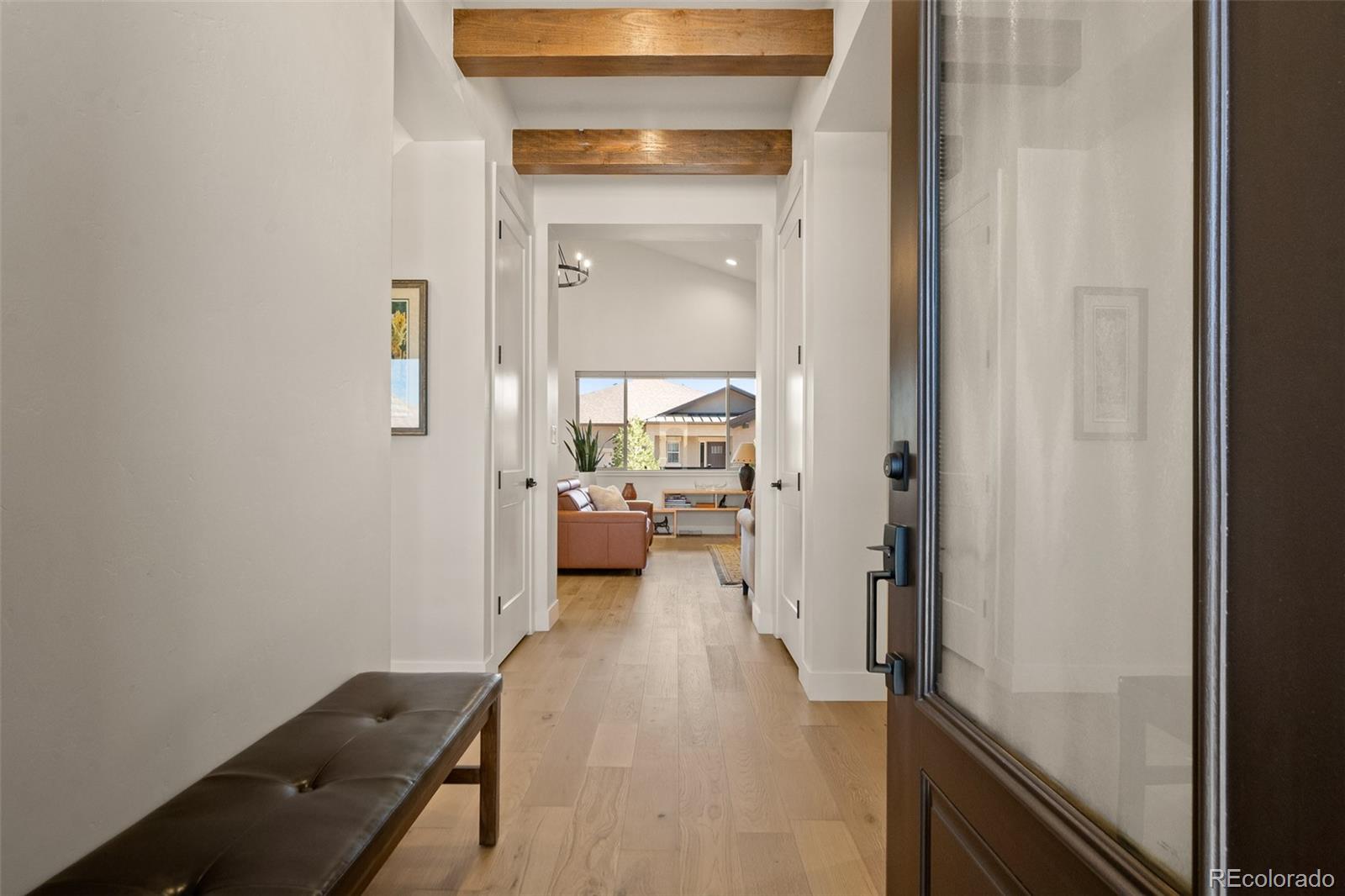 2287 Rock Valley Road Grand Junction, CO 81507 - Photo 2 of 32 a view of a hallway with a livingroom and a way to rooms
