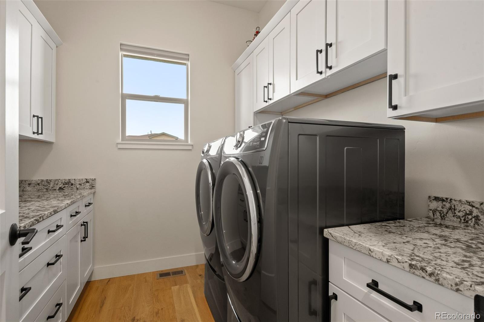 2287 Rock Valley Road Grand Junction, CO 81507 - Photo 24 of 32 a utility room with cabinets