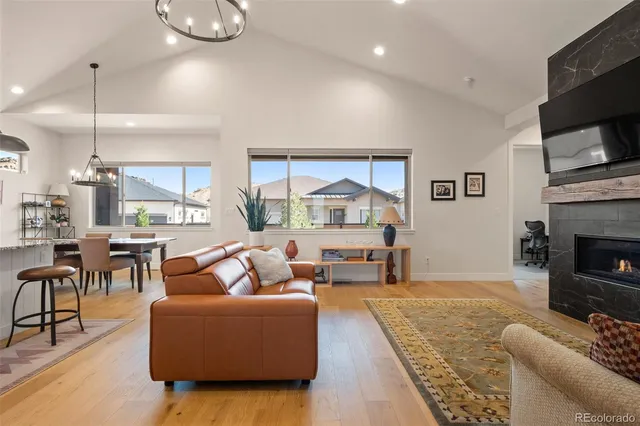 a living room with fireplace furniture and a flat screen tv