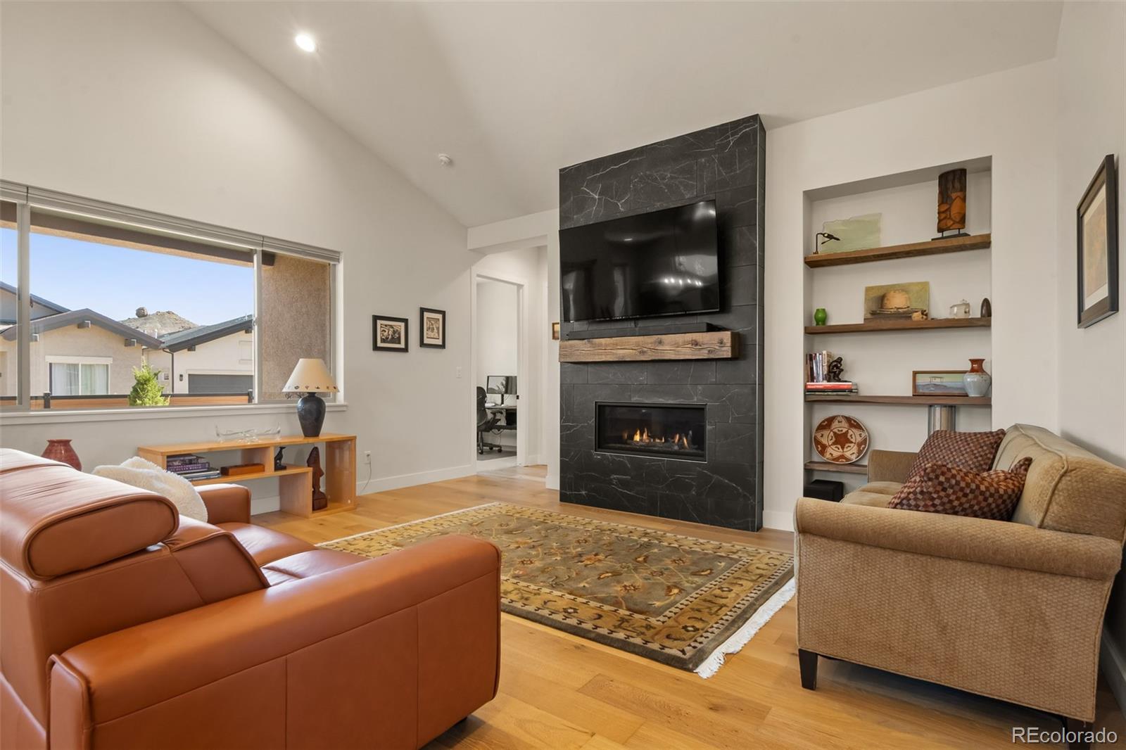 2287 Rock Valley Road Grand Junction, CO 81507 - Photo 4 of 32 a living room with furniture and a fireplace