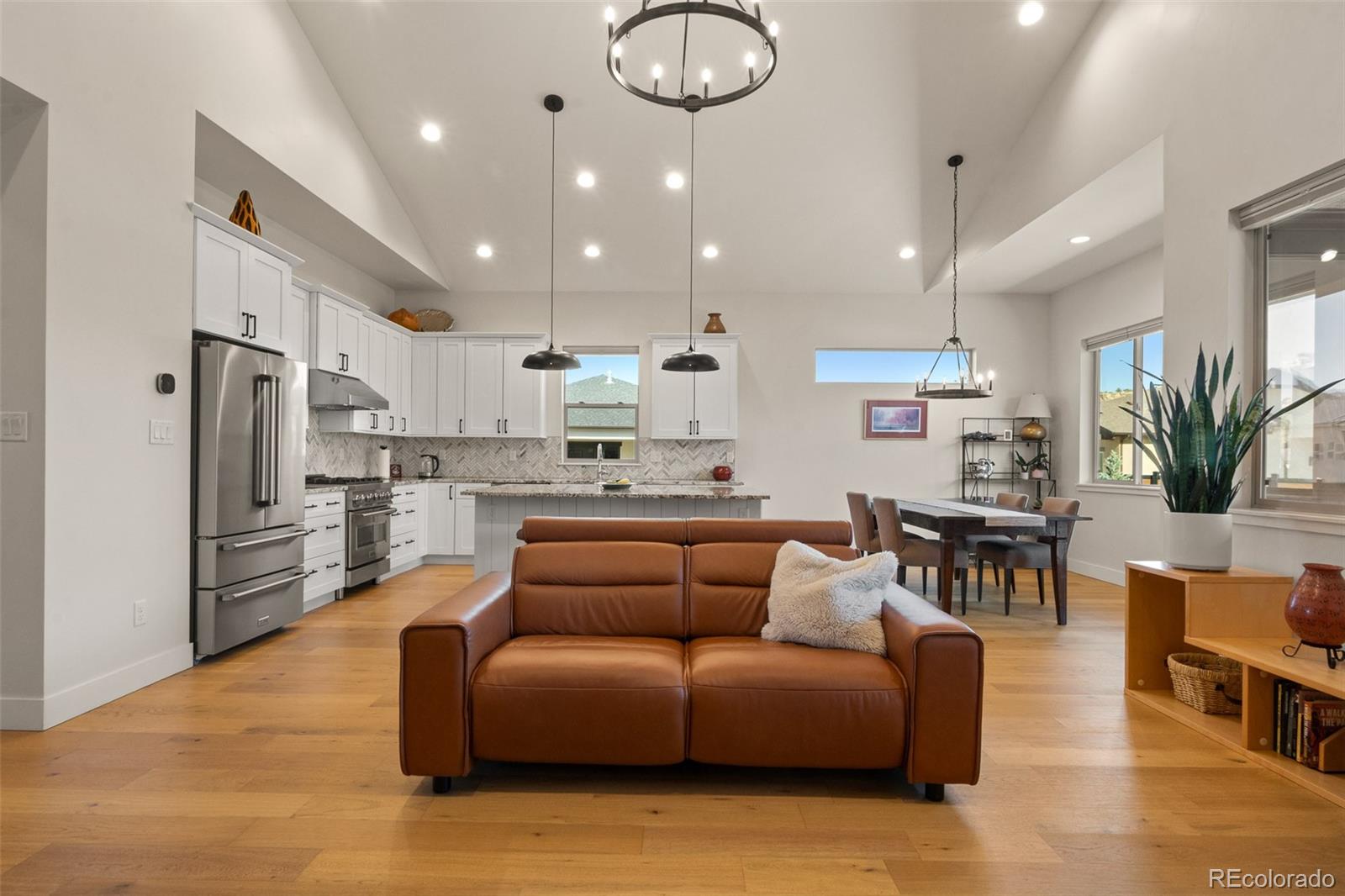 2287 Rock Valley Road Grand Junction, CO 81507 - Photo 5 of 32 a living room with furniture kitchen and a chandelier