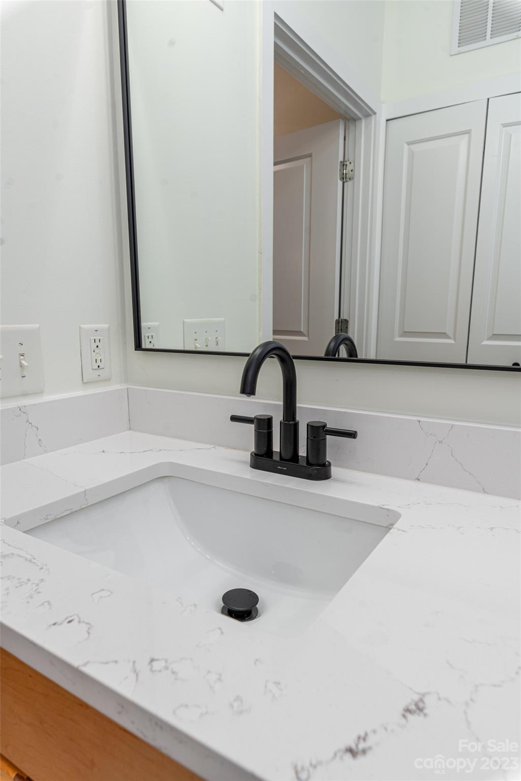 630 Calvert Street, Unit 307 Charlotte, NC 28208 - Photo 15 of 27 a bathroom with a sink and a tub