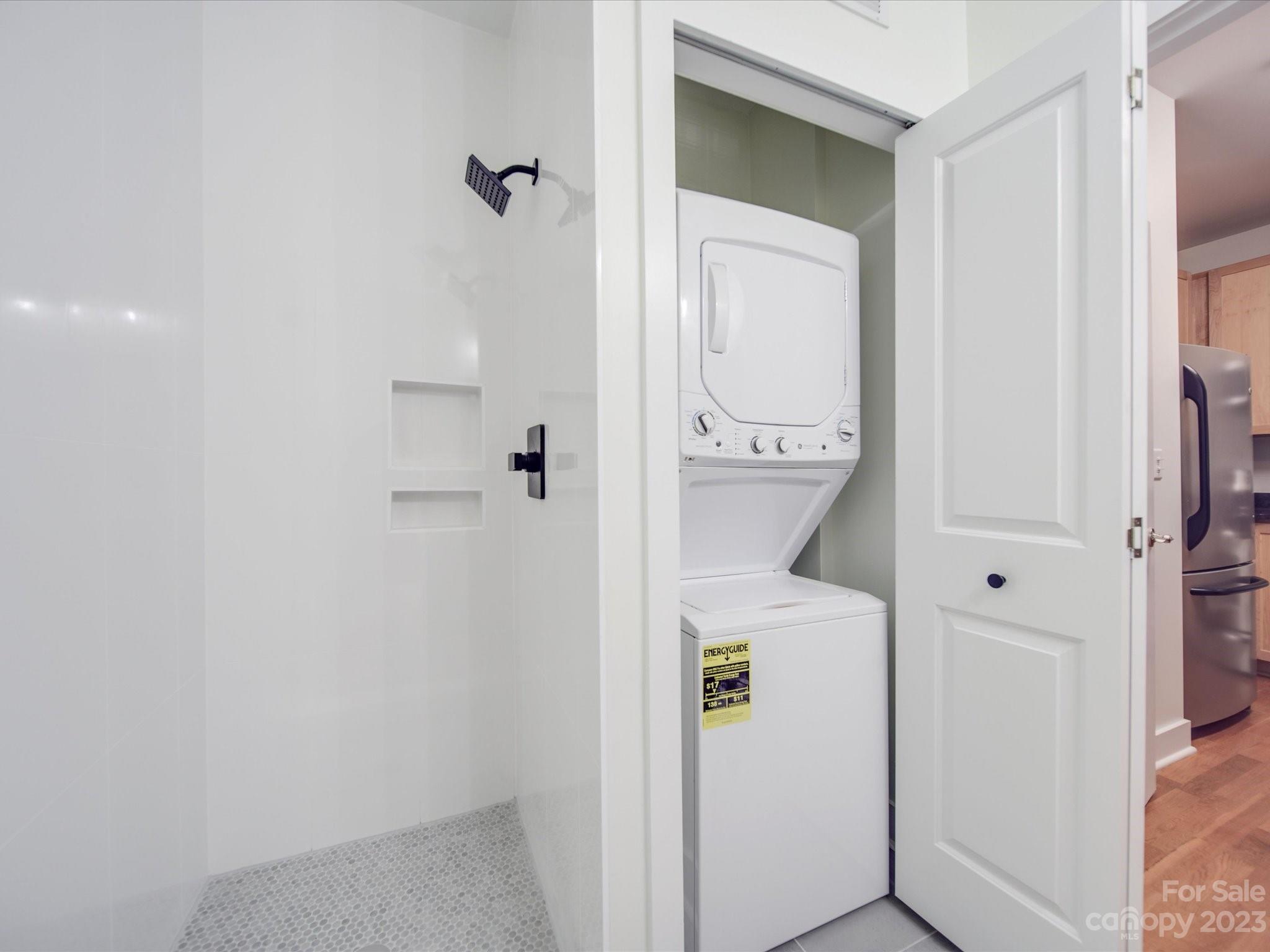 630 Calvert Street, Unit 307 Charlotte, NC 28208 - Photo 18 of 27 a bathroom with a shower
