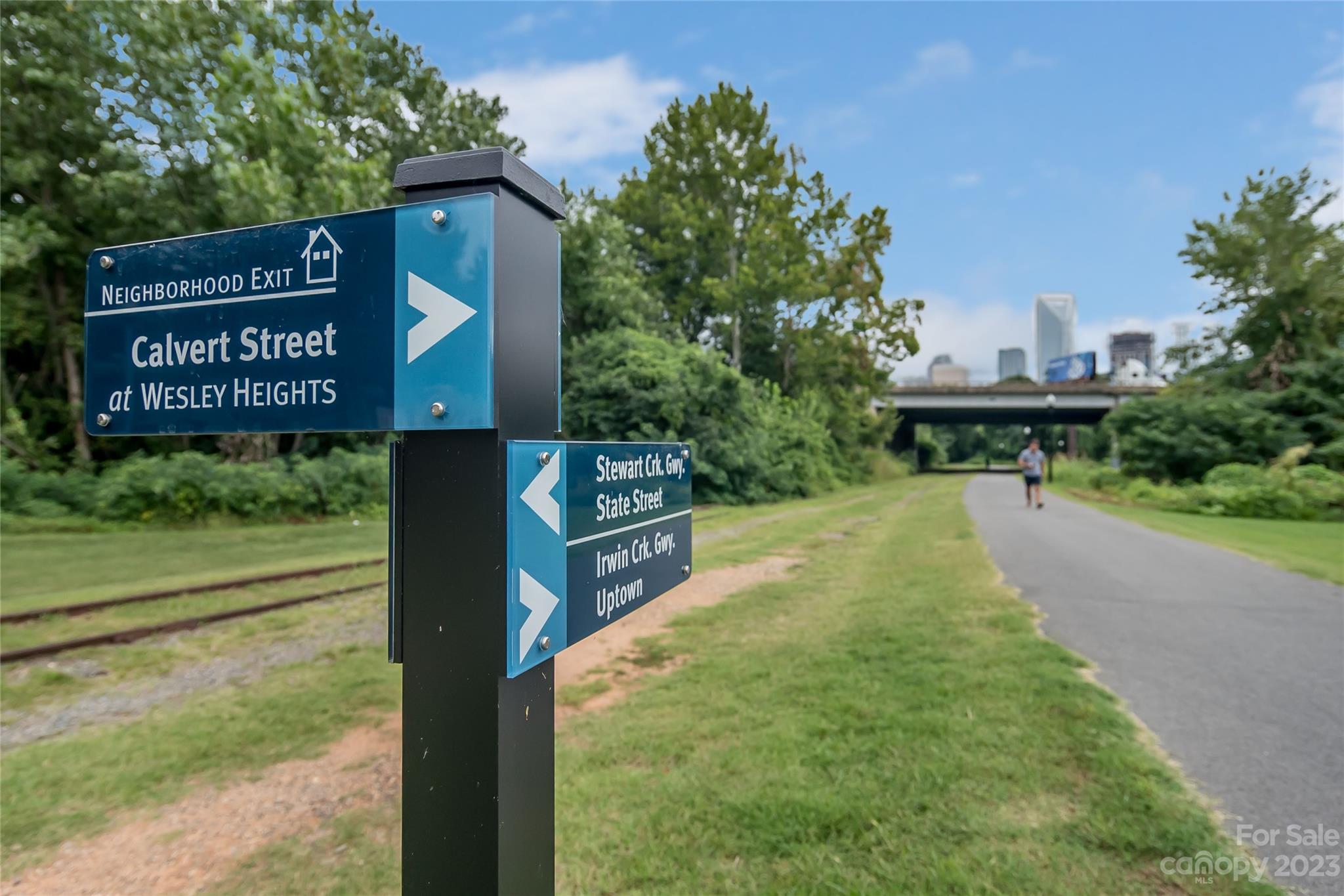 630 Calvert Street, Unit 307 Charlotte, NC 28208 - Photo 24 of 27 a view of a street with benches in the background