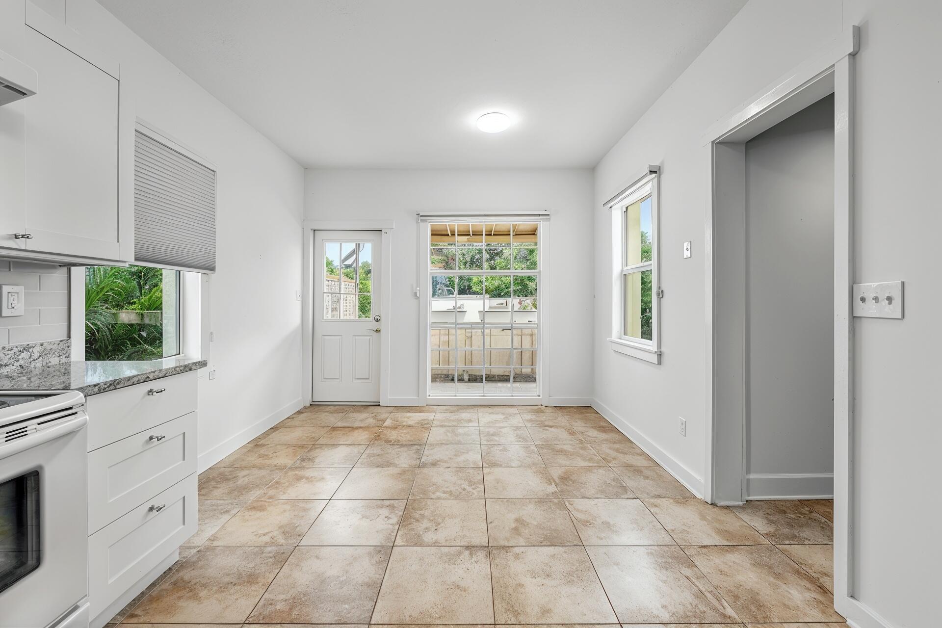 234 Australian Avenue, Unit B Palm Beach, FL 33480 - Photo 4 of 8 a view of an empty room with a window