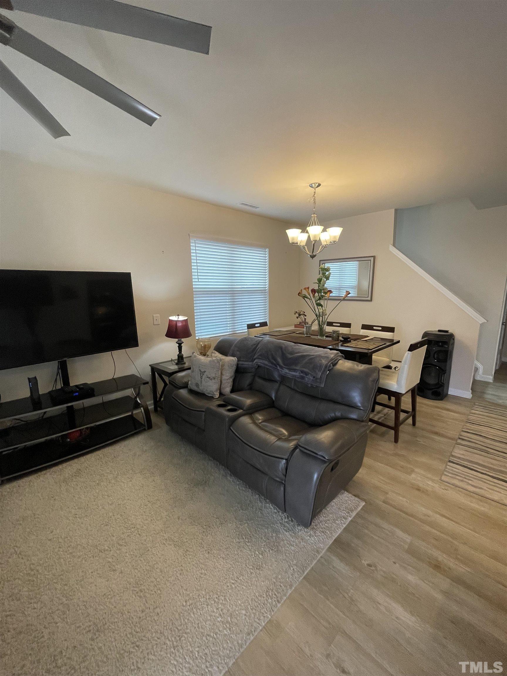 3720 Putman Road Raleigh, NC 27610 - Photo 6 of 9 a living room with furniture and a flat screen tv