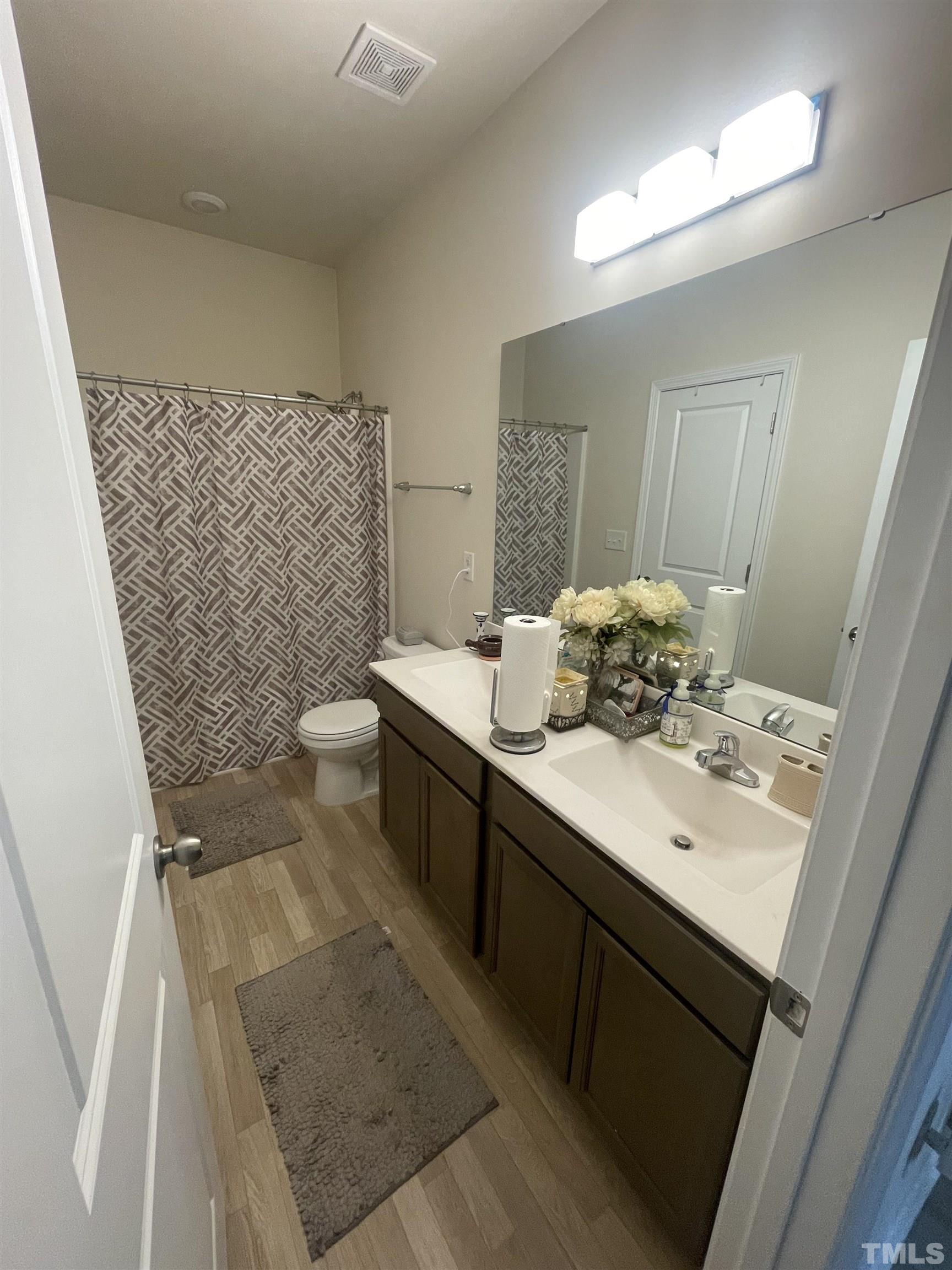 3720 Putman Road Raleigh, NC 27610 - Photo 9 of 9 a bathroom with a sink toilet and shower