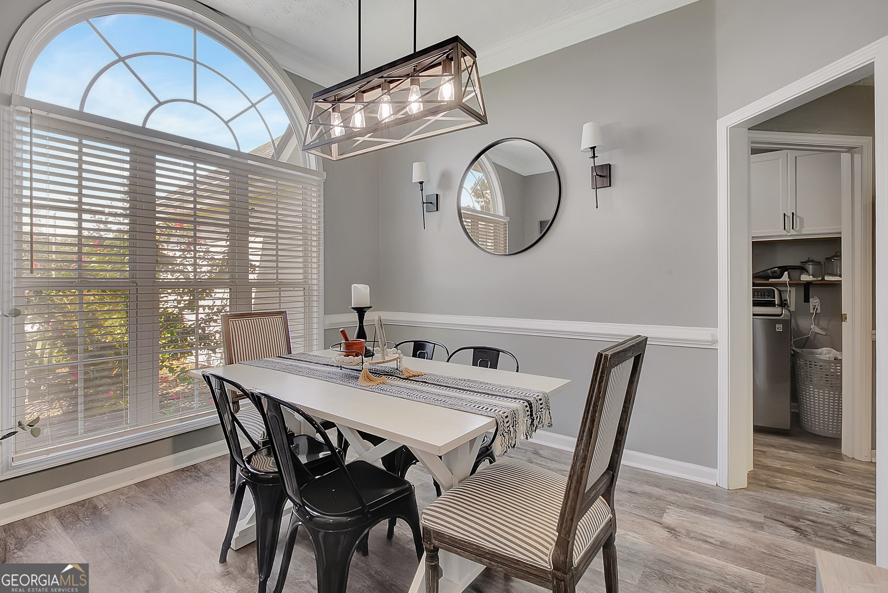 229 John Lovelace Road LaGrange, GA 30241 - Photo 7 of 59 a view of a dining room with furniture a chandelier and wooden floor