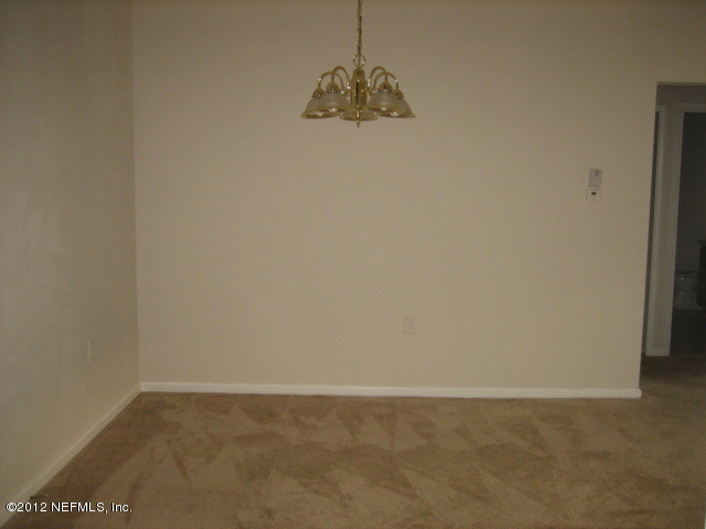 7920 Merrill Road, Unit 1501 Jacksonville, FL 32277 - Photo 3 of 11 a room that has a window in it