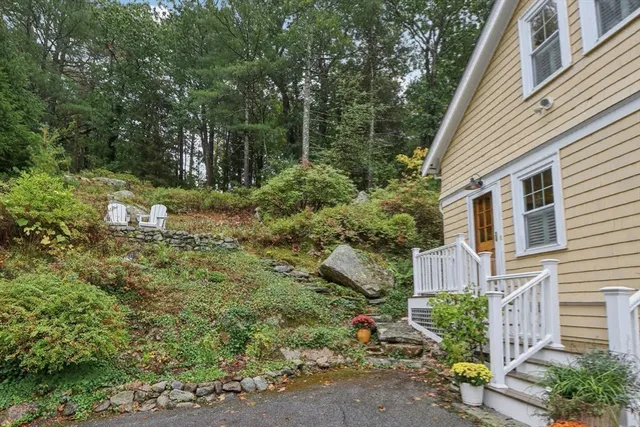 a backyard of a house with lots of green space