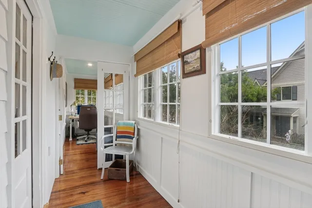 a view of living room with furniture and wooden floor