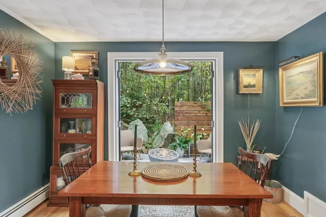 a dining room with furniture a window and a chandelier