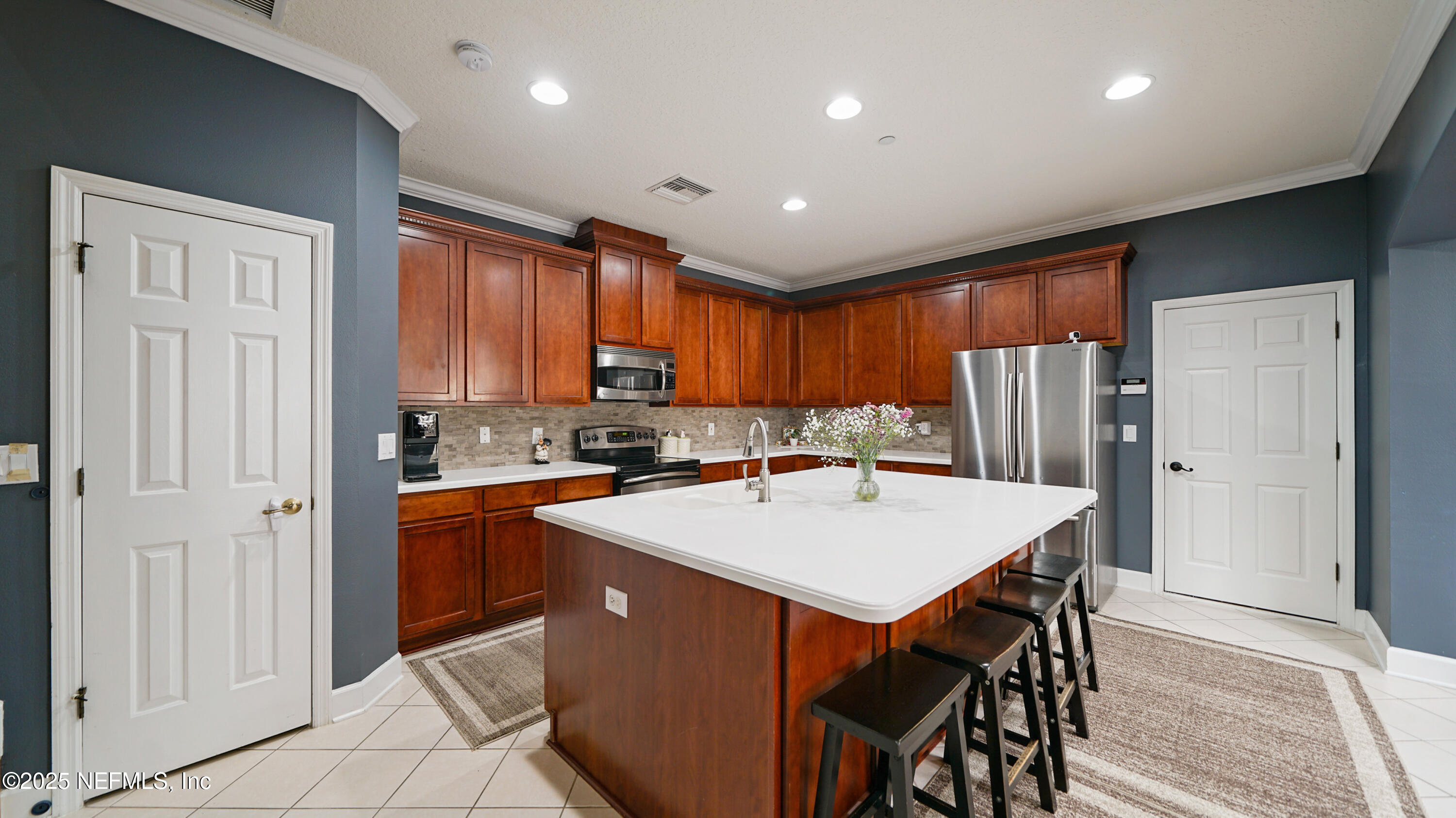 6127 Eclipse Circle Jacksonville, FL 32258 - Photo 11 of 37 a kitchen with stainless steel appliances granite countertop a refrigerator a sink dishwasher and a stove with wooden floor