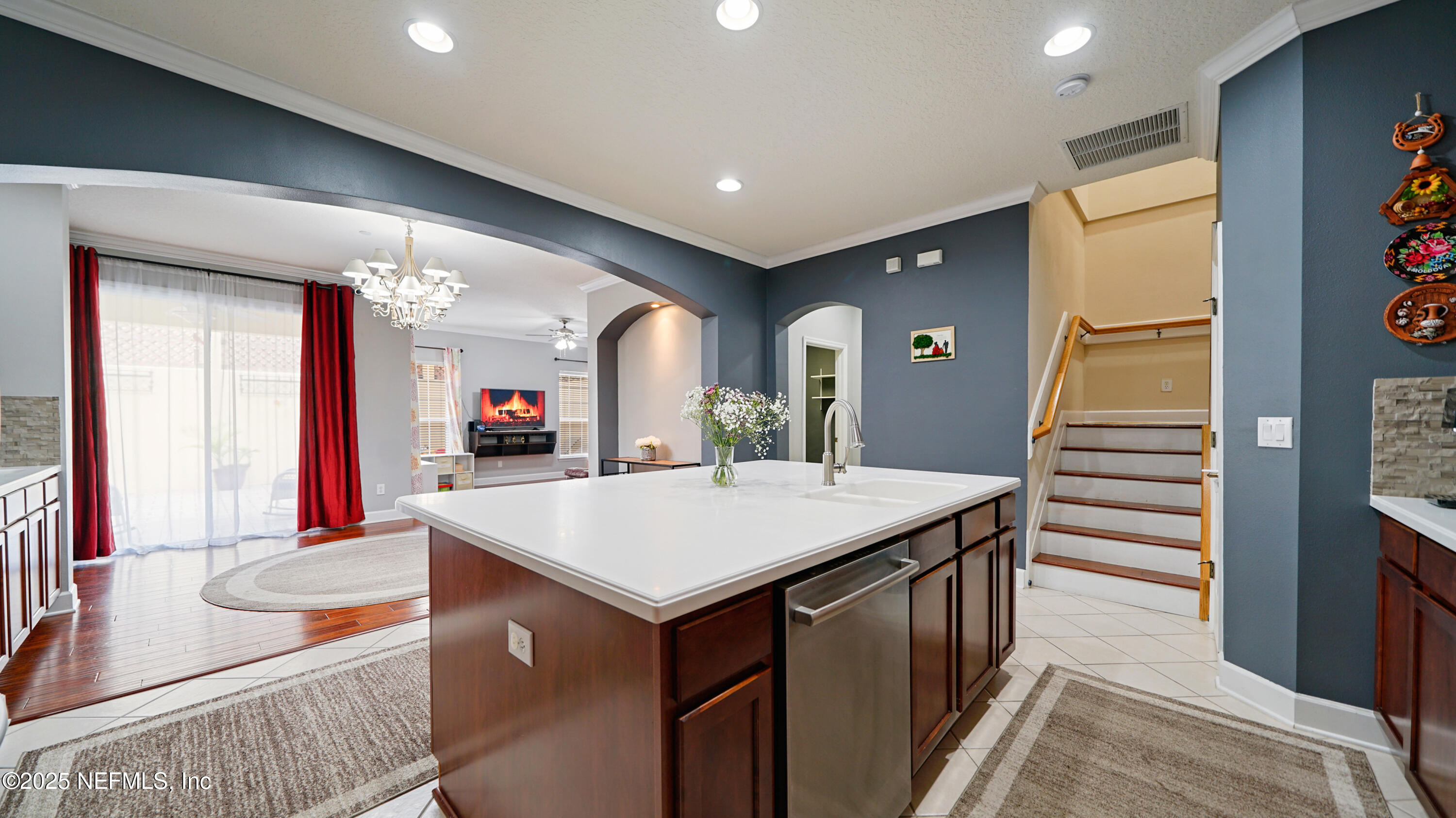 6127 Eclipse Circle Jacksonville, FL 32258 - Photo 12 of 37 a view of kitchen island with furniture and wooden floor