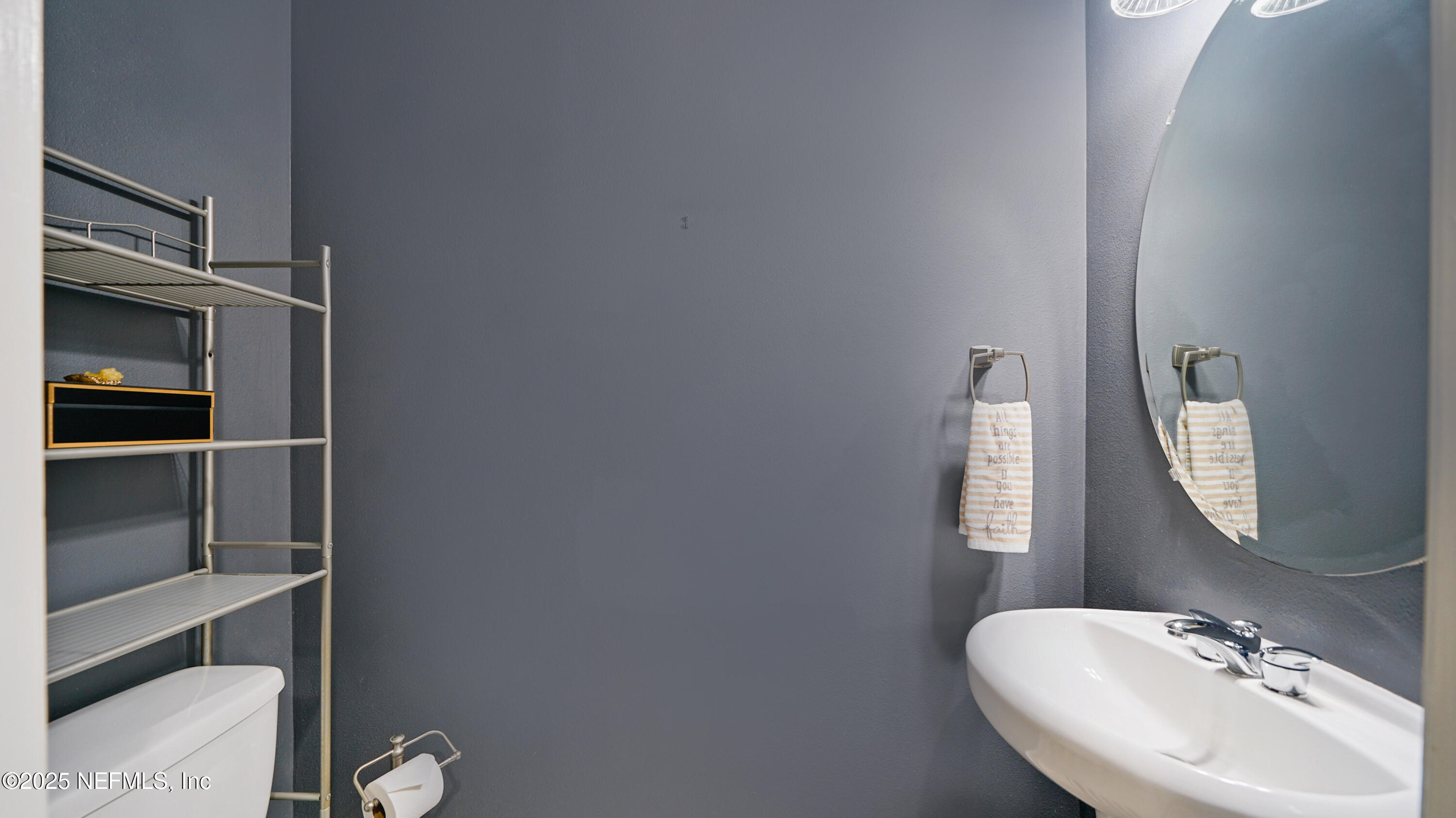 6127 Eclipse Circle Jacksonville, FL 32258 - Photo 16 of 37 a bathroom with a sink mirror and window