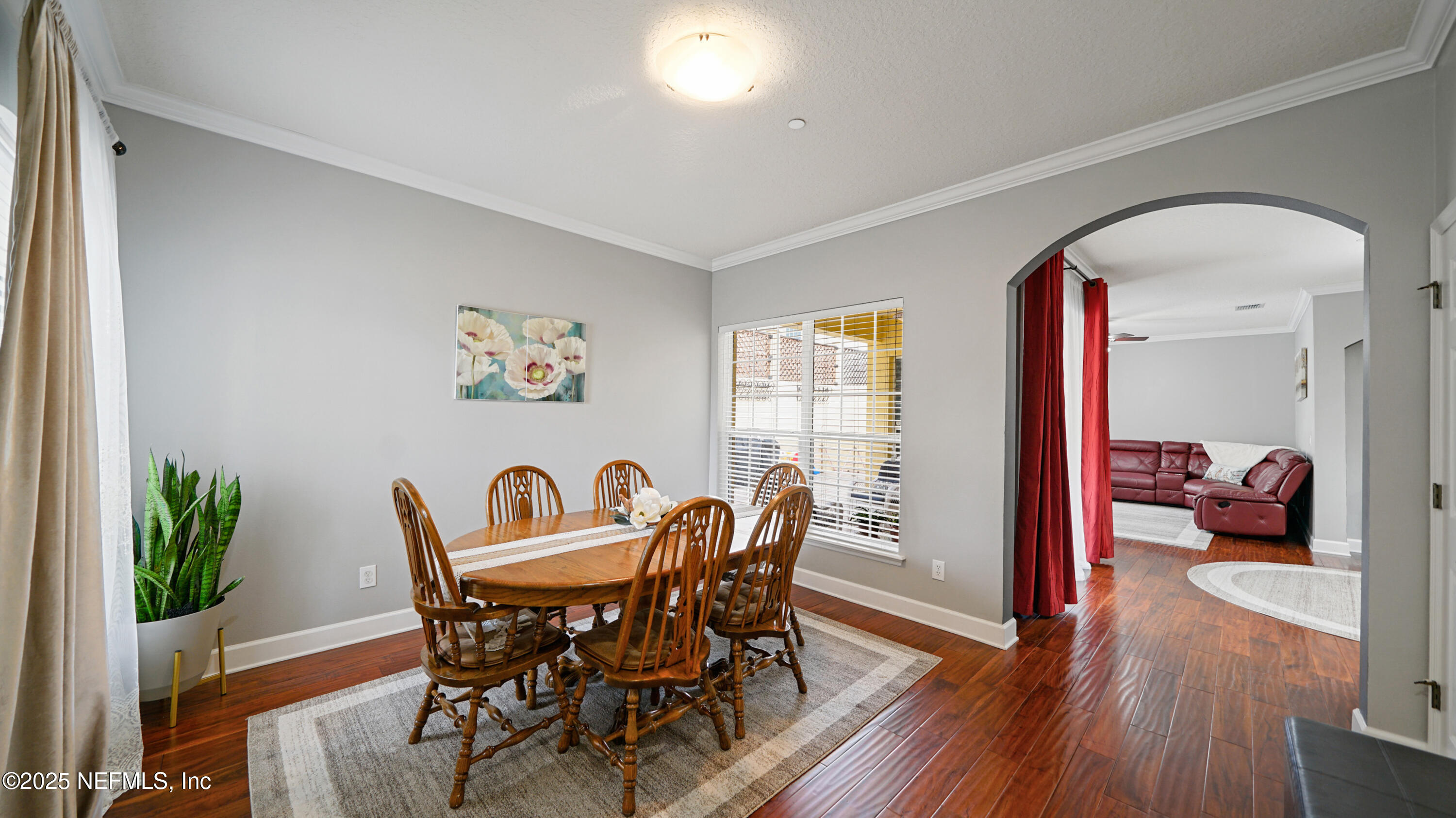 6127 Eclipse Circle Jacksonville, FL 32258 - Photo 2 of 37 a view of a dining room with furniture and wooden floor