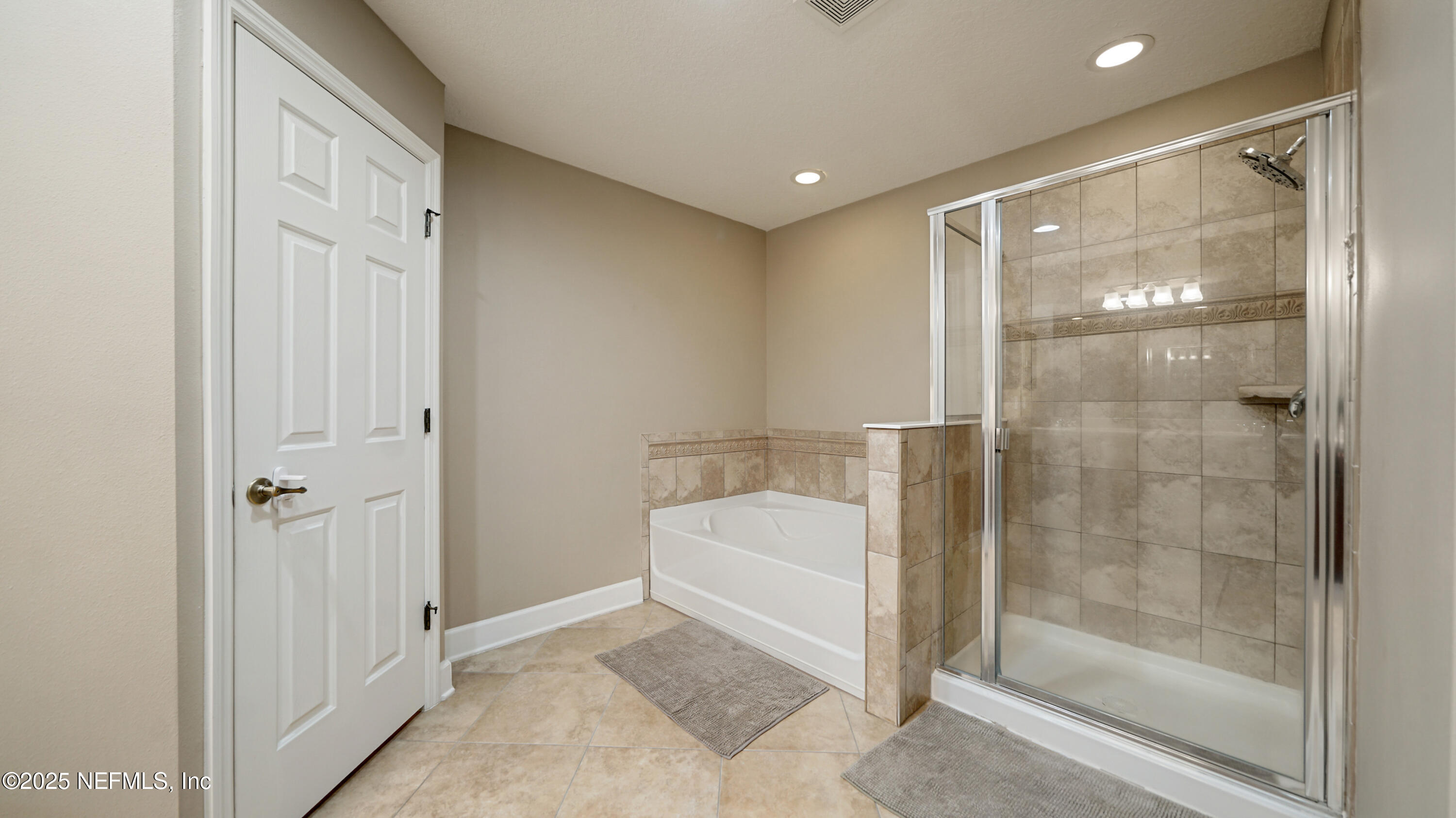 6127 Eclipse Circle Jacksonville, FL 32258 - Photo 22 of 37 a bathroom with a bathtub and a shower