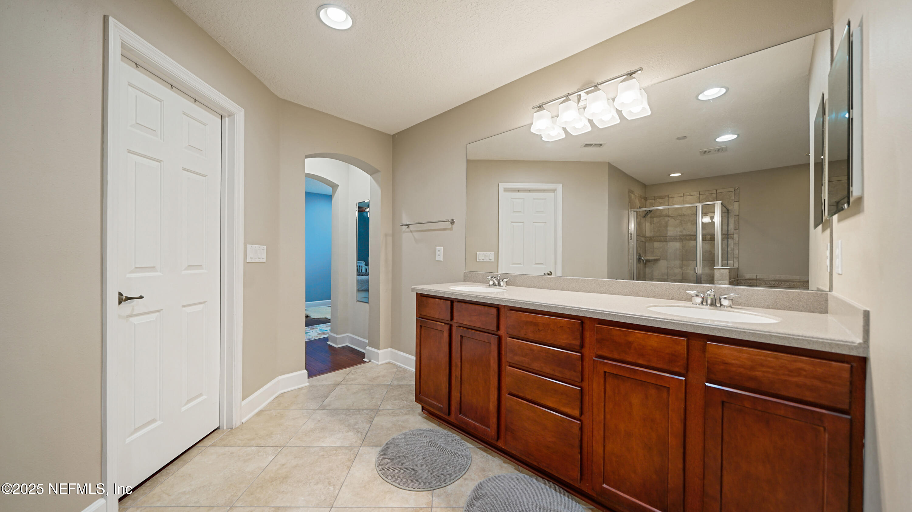 6127 Eclipse Circle Jacksonville, FL 32258 - Photo 23 of 37 a spacious bathroom with a double vanity sink and a mirror