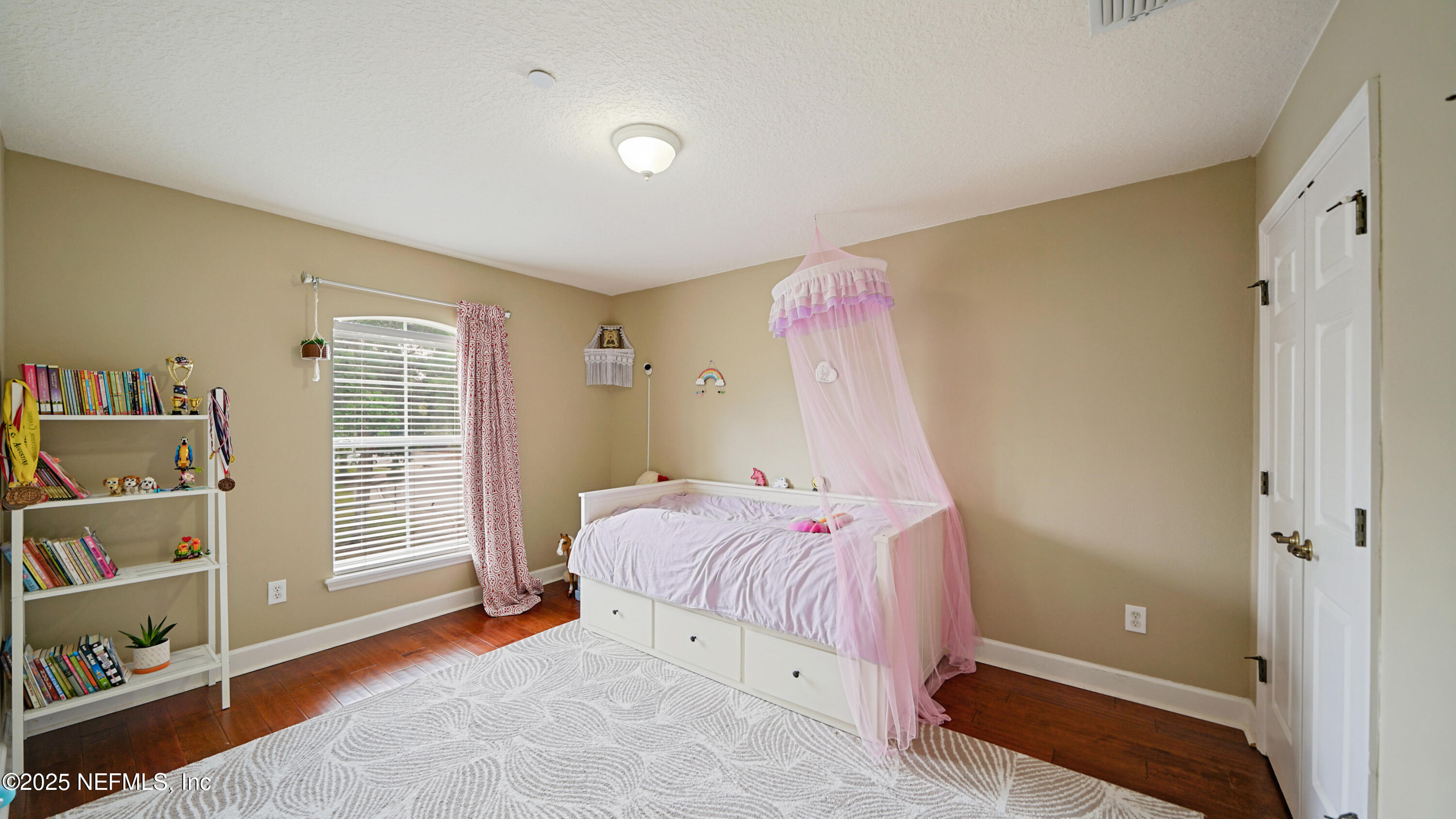 6127 Eclipse Circle Jacksonville, FL 32258 - Photo 24 of 37 a bedroom with a bed and a window