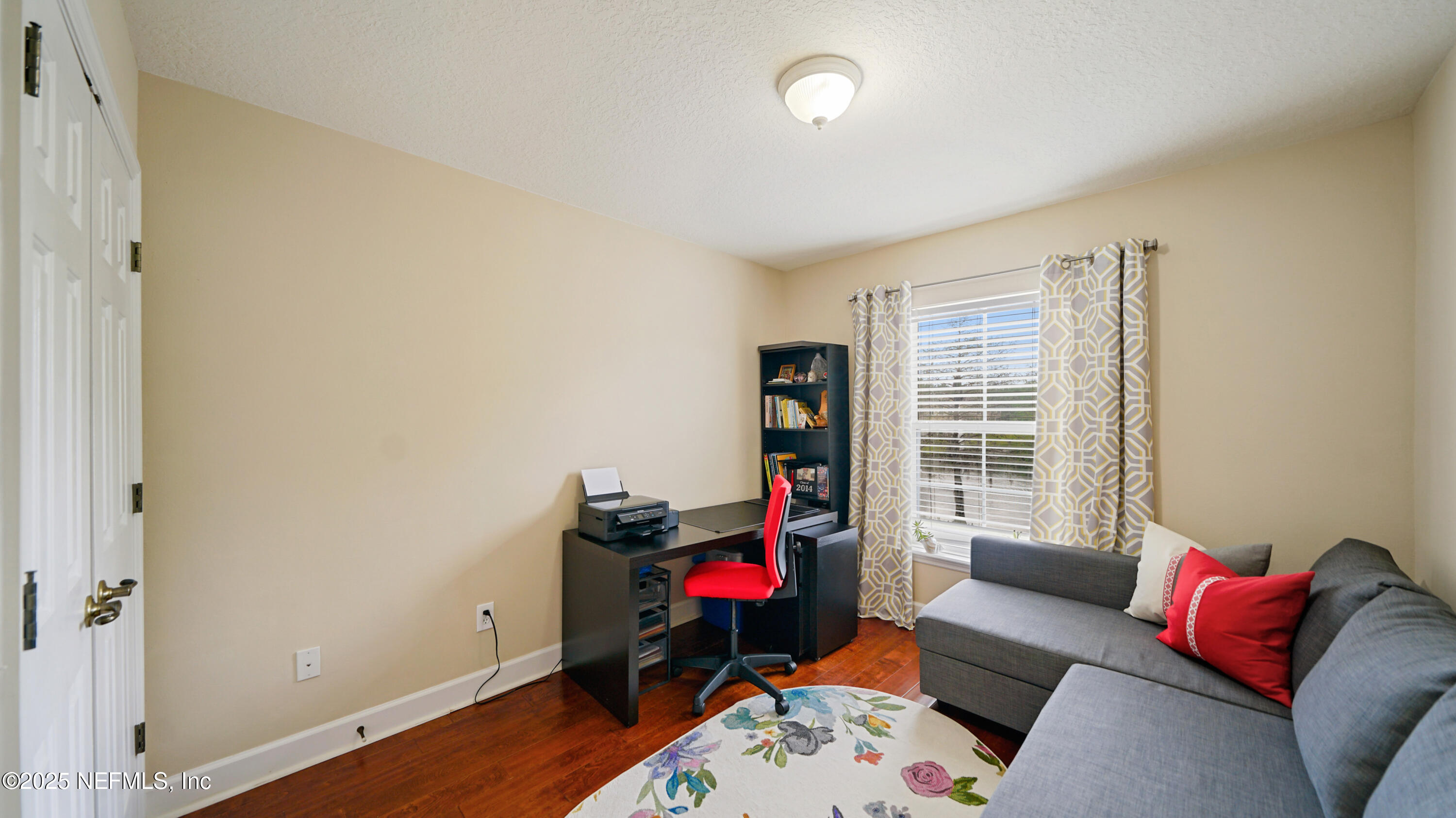 6127 Eclipse Circle Jacksonville, FL 32258 - Photo 26 of 37 a living room with furniture and a window
