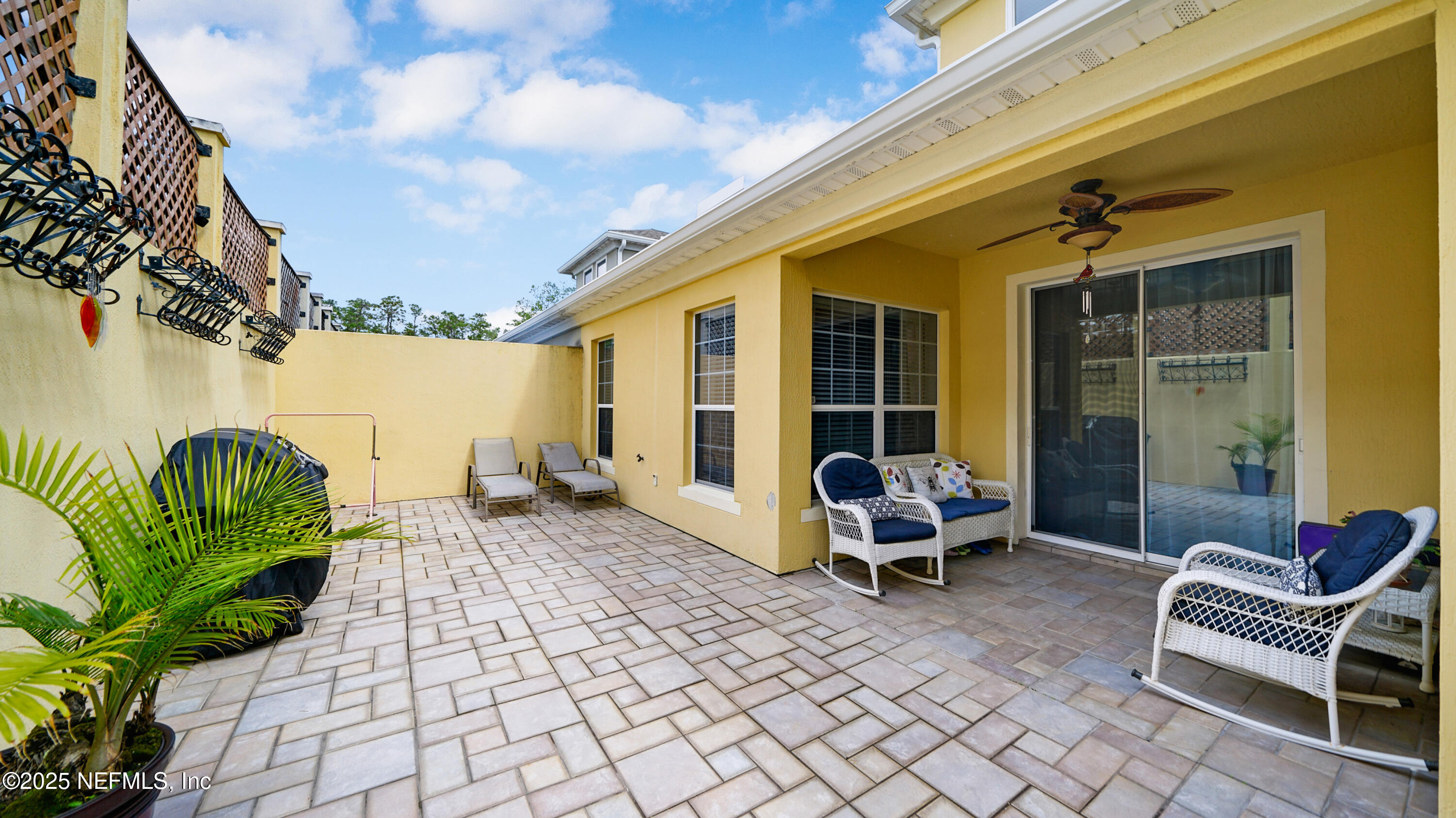 6127 Eclipse Circle Jacksonville, FL 32258 - Photo 27 of 37 a balcony with furniture and a potted plant