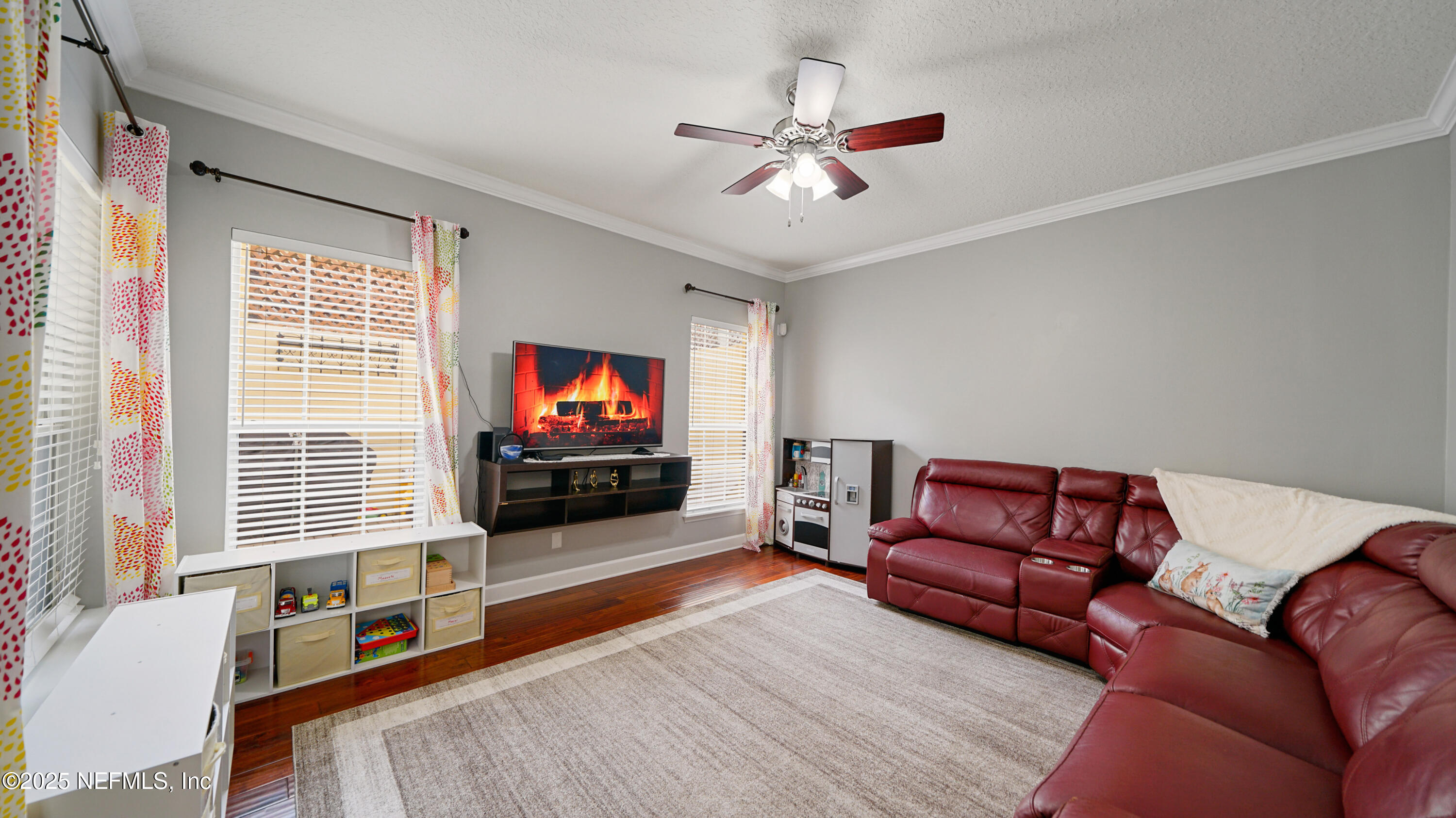 6127 Eclipse Circle Jacksonville, FL 32258 - Photo 3 of 37 a living room with furniture and a flat screen tv