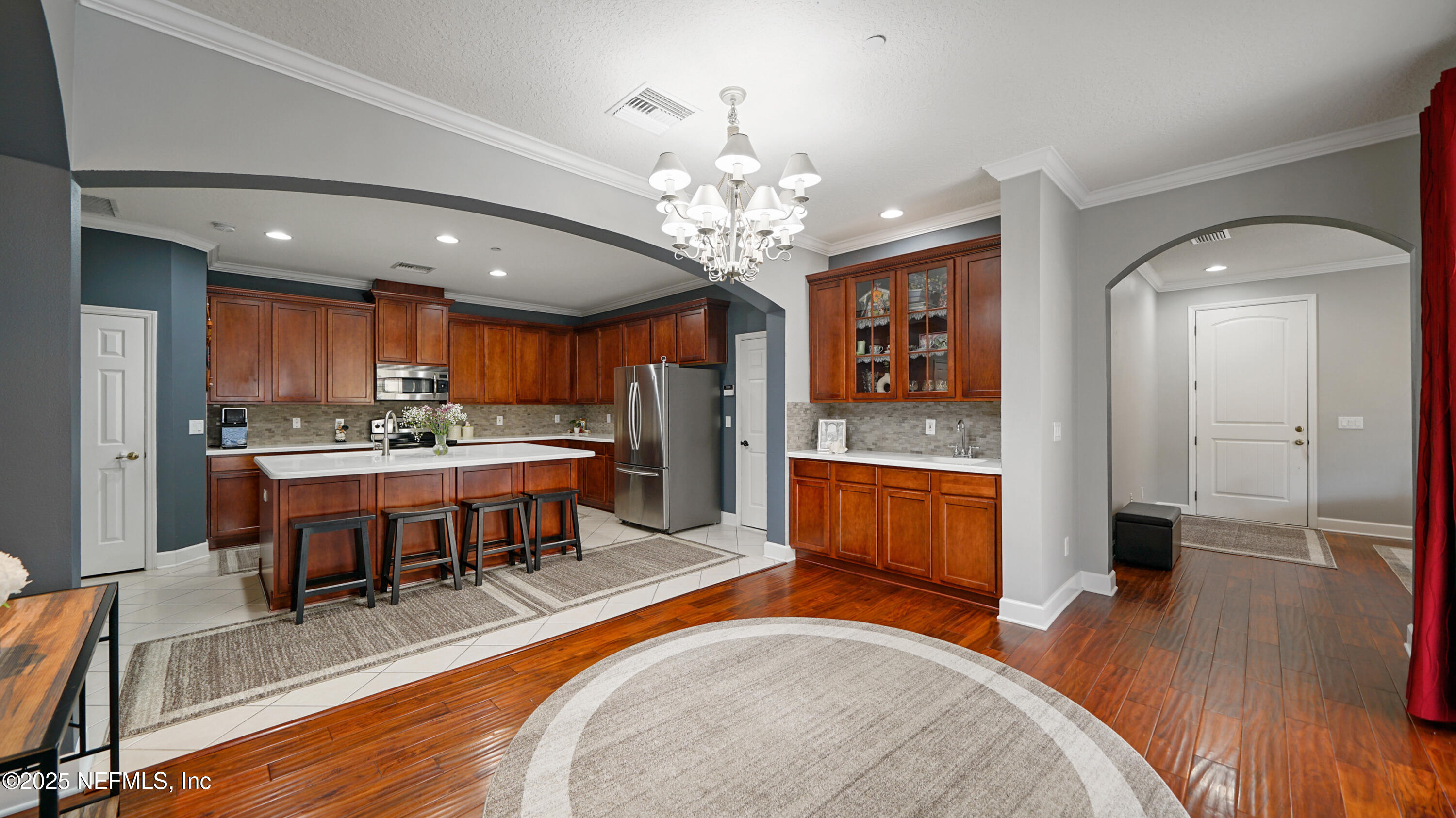 6127 Eclipse Circle Jacksonville, FL 32258 - Photo 6 of 37 a large living room with stainless steel appliances kitchen island granite countertop furniture and a kitchen view