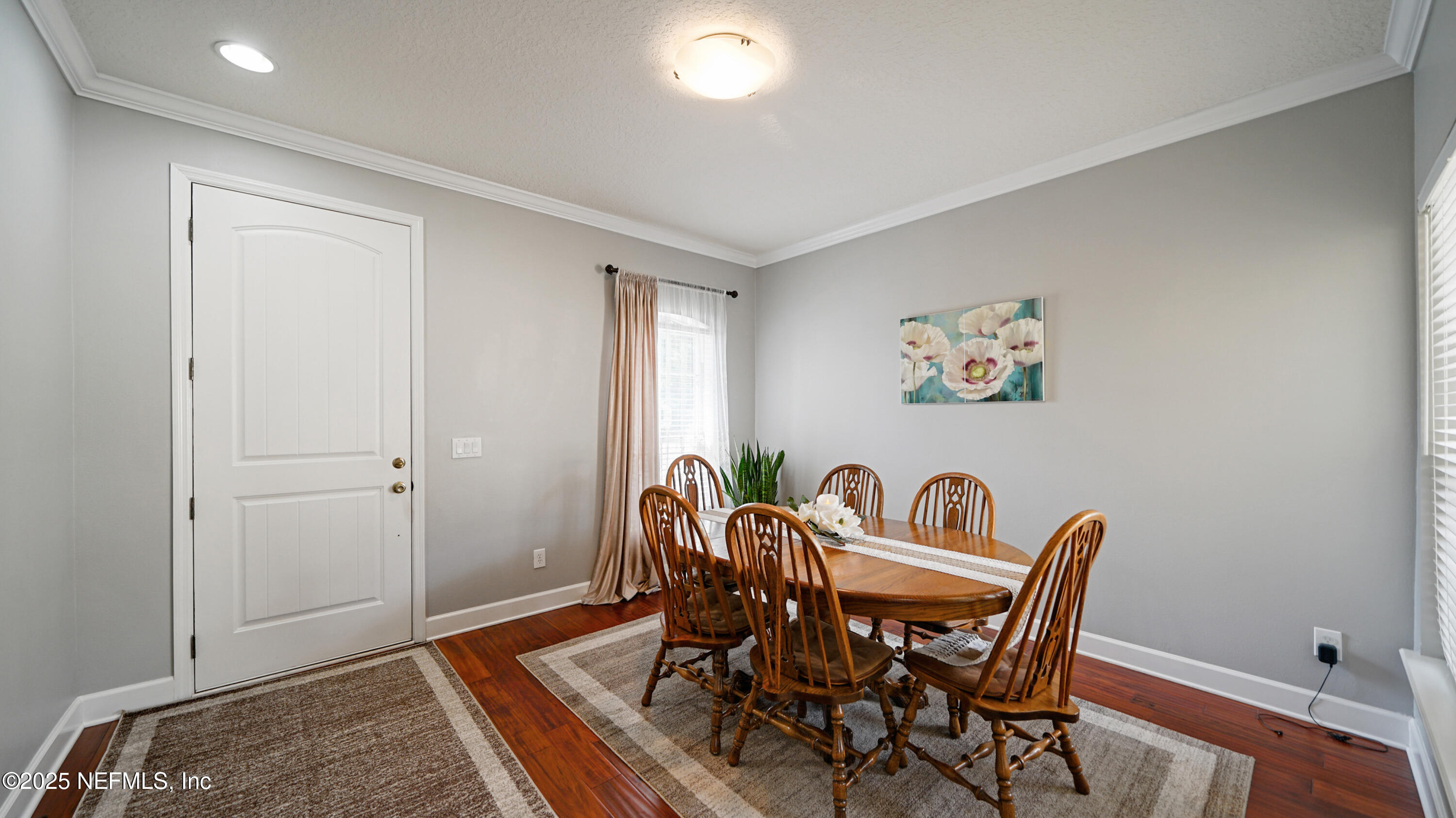 6127 Eclipse Circle Jacksonville, FL 32258 - Photo 7 of 37 a view of a dining room with furniture and wooden floor