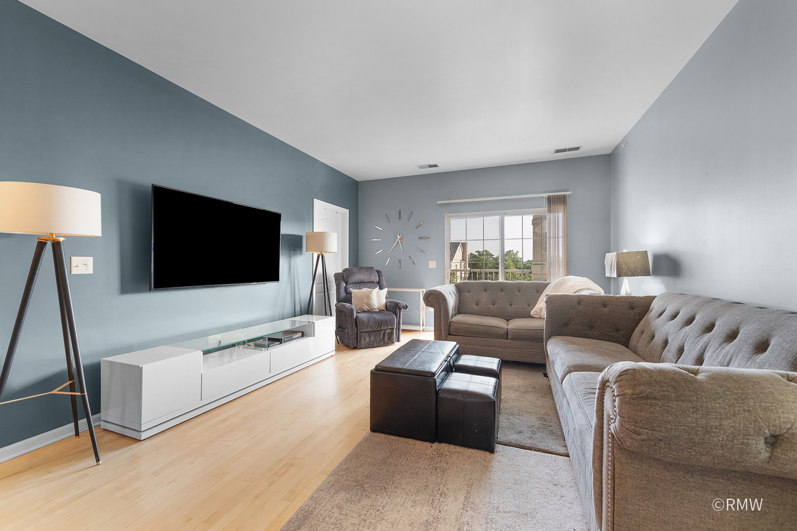 1259 West Lake Street, Unit 304 Addison, IL 60101 - Photo 15 of 43 a living room with furniture and a flat screen tv