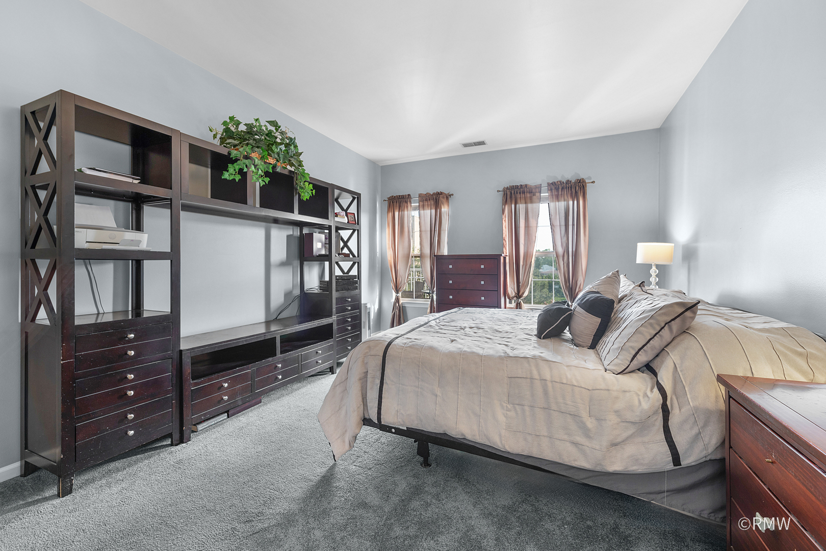 1259 West Lake Street, Unit 304 Addison, IL 60101 - Photo 19 of 43 a bedroom with a bed table and a window