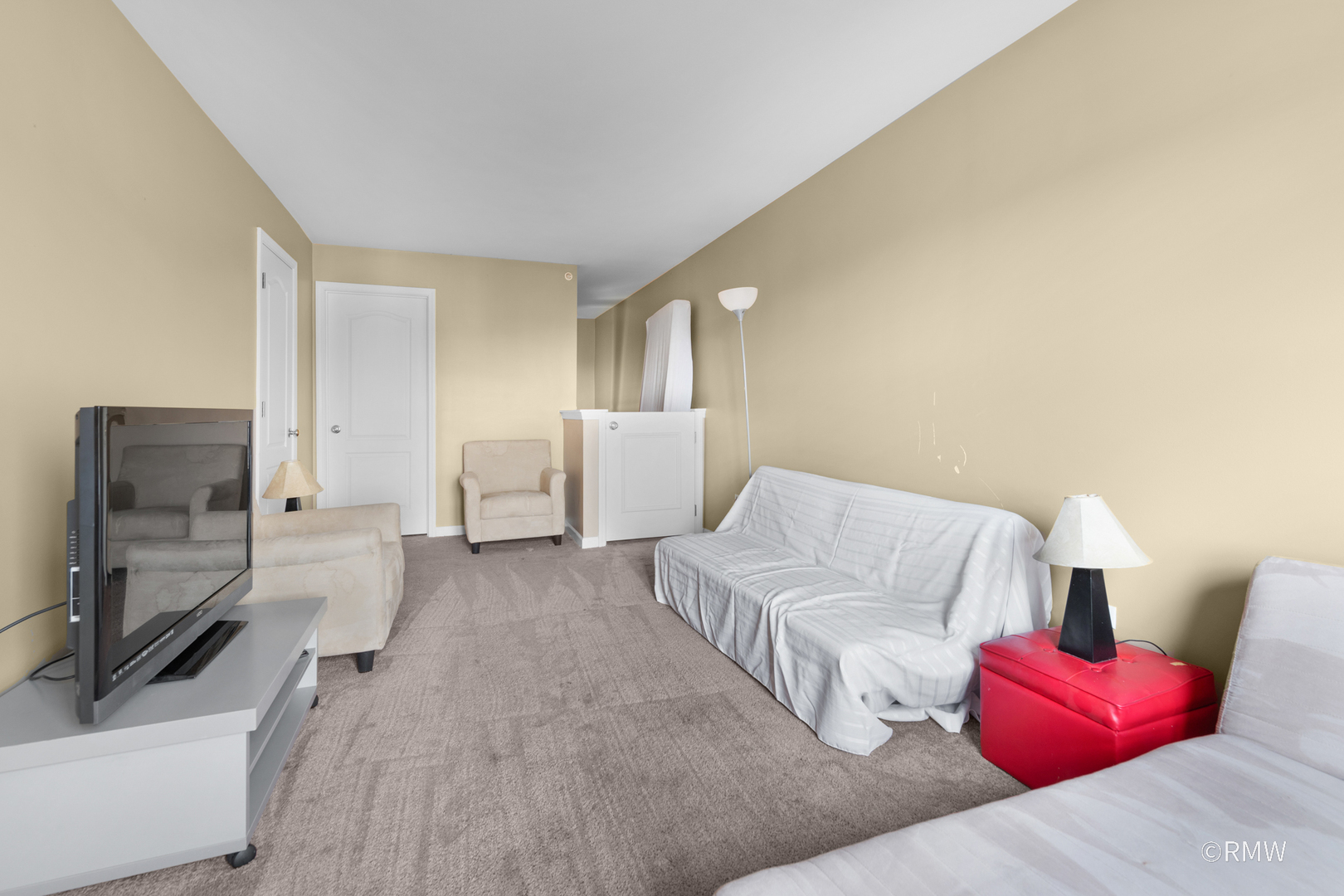 1259 West Lake Street, Unit 304 Addison, IL 60101 - Photo 24 of 43 a living room with furniture and a flat screen tv