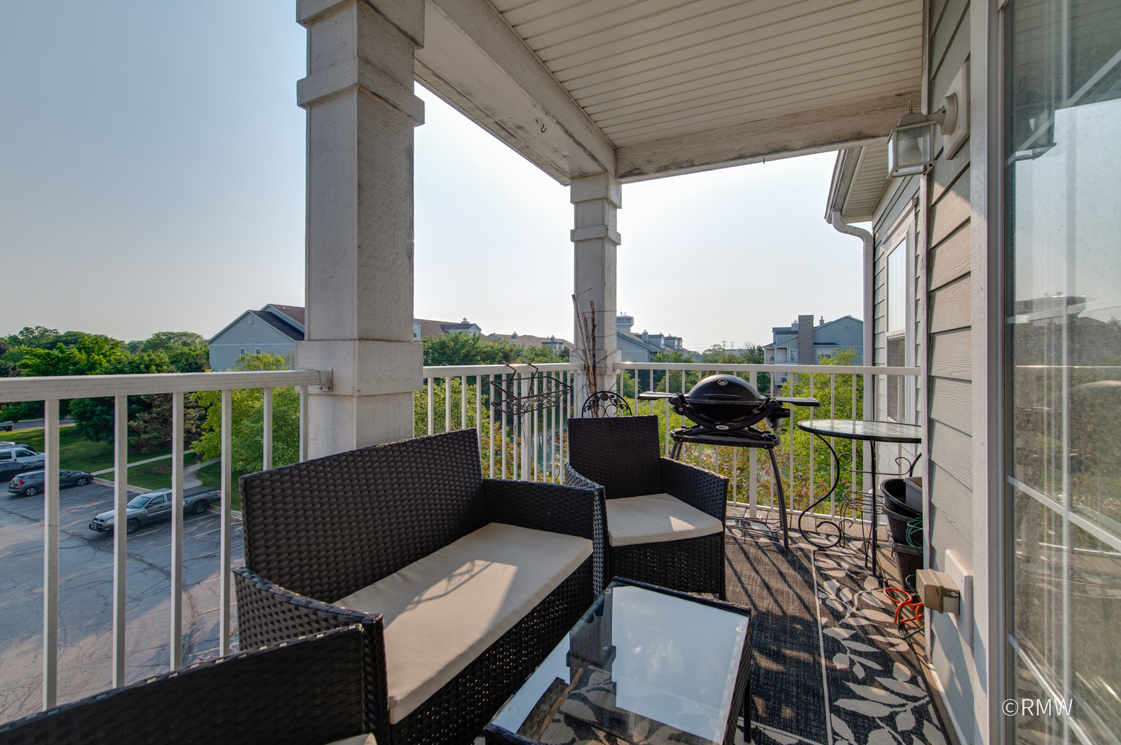 1259 West Lake Street, Unit 304 Addison, IL 60101 - Photo 26 of 43 a view of a chairs and table in the balcony