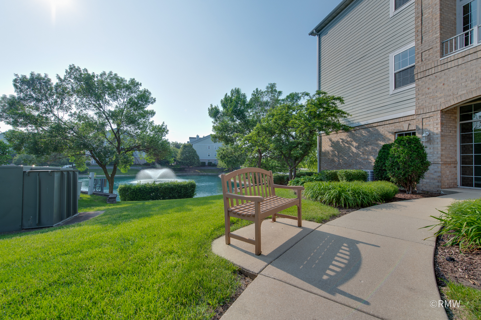 1259 West Lake Street, Unit 304 Addison, IL 60101 - Photo 7 of 43 a view of a chair and table in the back yard of the house