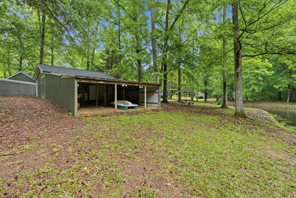 542 Knox Chapel Road Social Circle, GA 30025 - Photo 42 of 52 a backyard of a house with lots of green space