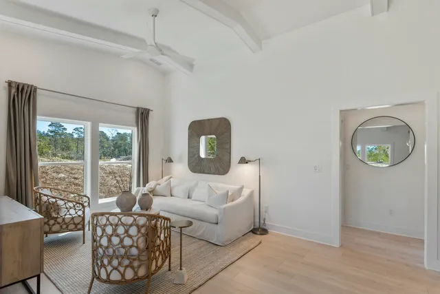 a living room with furniture and a window