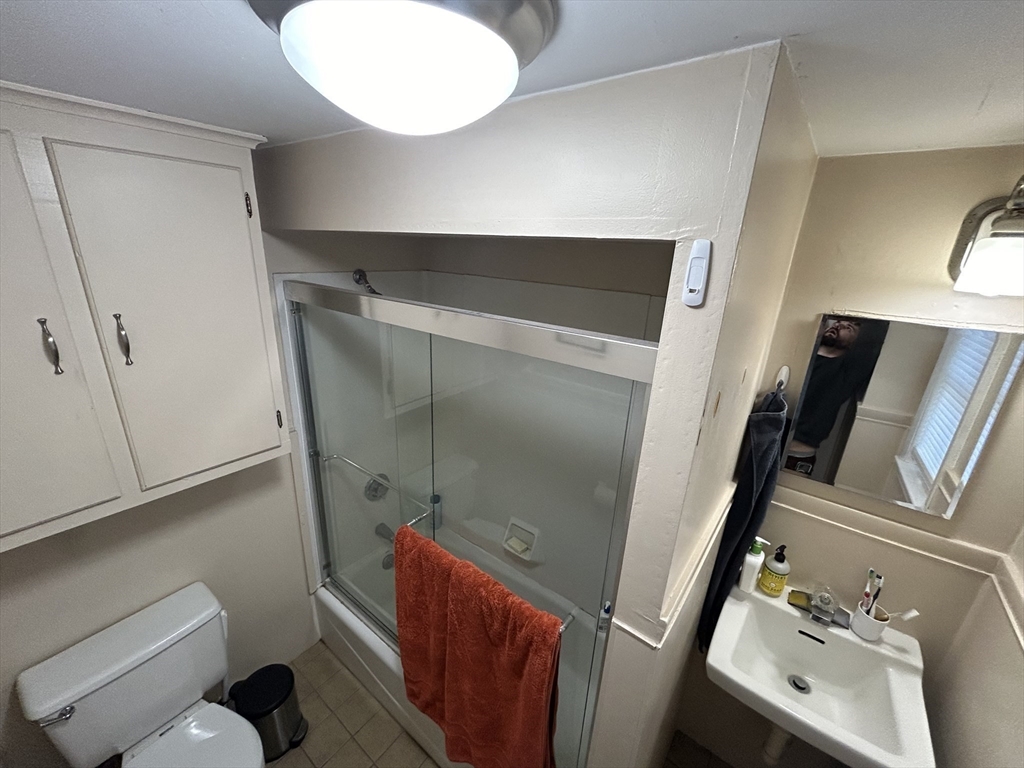 9 Crescent Square Newton, MA 02458 - Photo 11 of 12 a bathroom with a sink and mirror