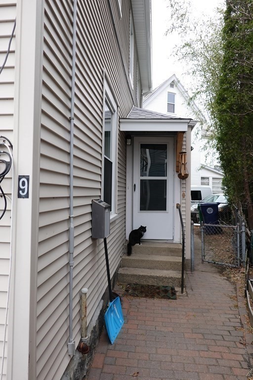 9 Crescent Square Newton, MA 02458 - Photo 2 of 12 a view of a house with a table and chairs