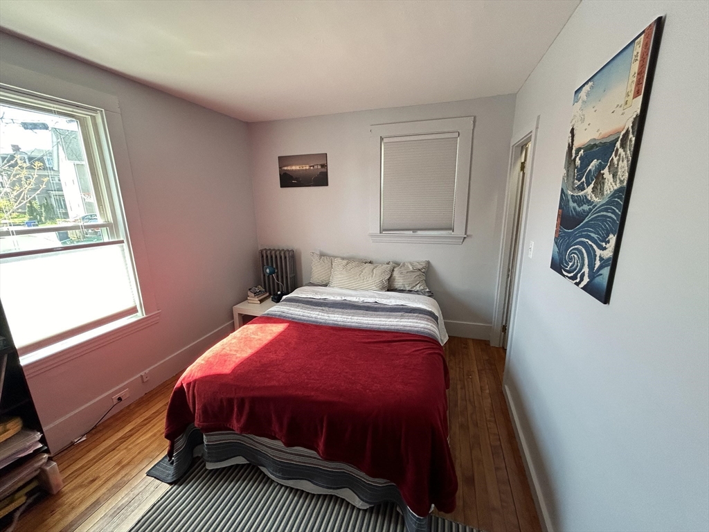 9 Crescent Square Newton, MA 02458 - Photo 8 of 12 a bedroom with a bed and a window