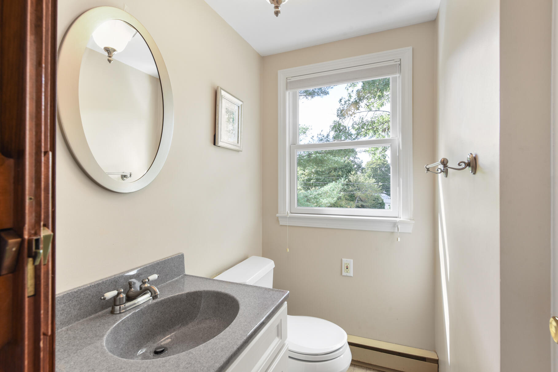 29 Wing Road Pocasset, MA 02559 - Photo 17 of 34 a bathroom with a sink a toilet and a mirror