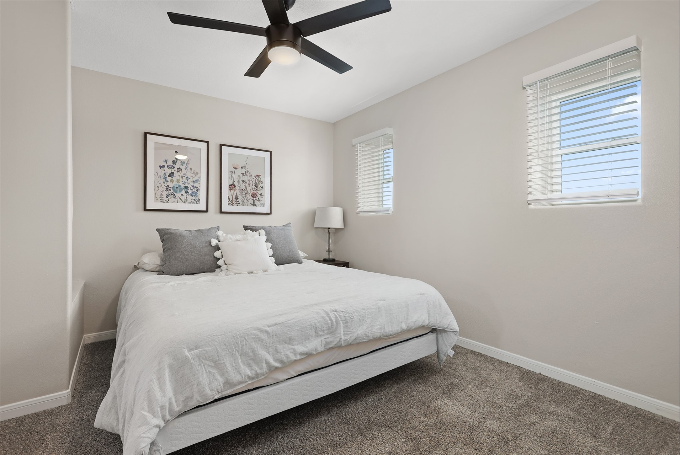 215 Postoffice Street, Unit 1208 Galveston, TX 77550 - Photo 13 of 19 a bedroom with a bed and painting on the wall