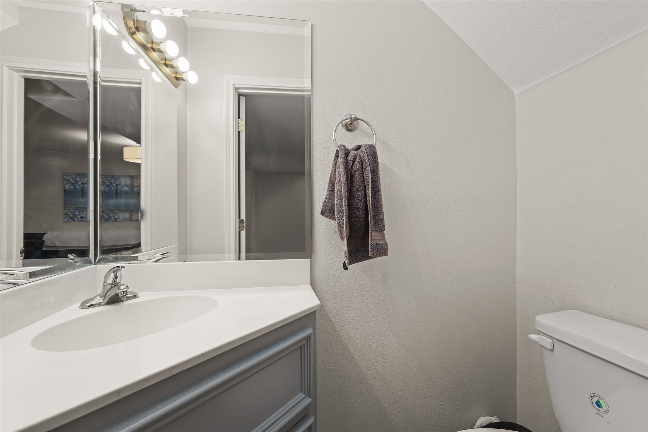 215 Postoffice Street, Unit 1208 Galveston, TX 77550 - Photo 7 of 19 a bathroom with a sink and a mirror