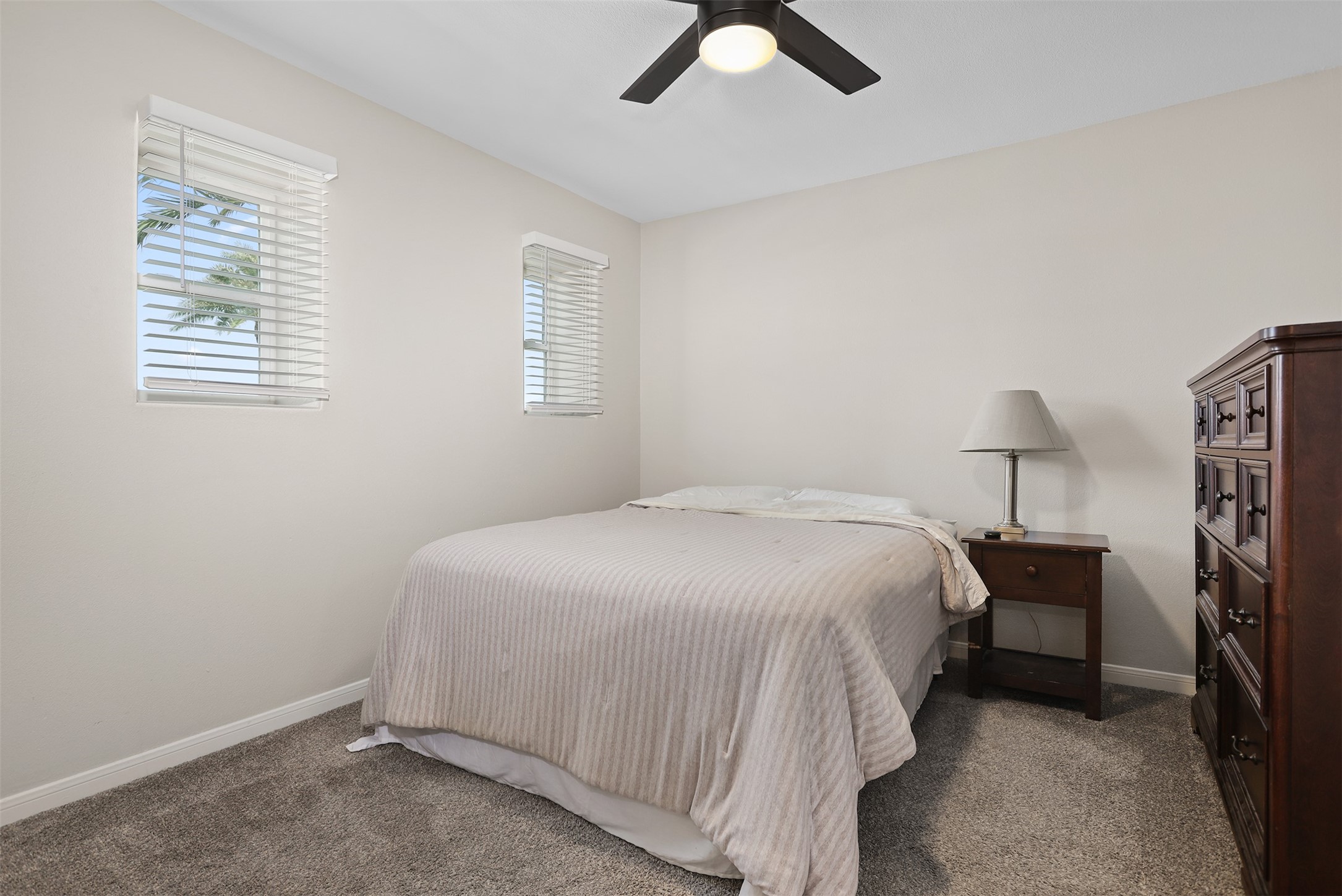 215 Postoffice Street, Unit 1208 Galveston, TX 77550 - Photo 10 of 19 a bedroom with a bed and a window