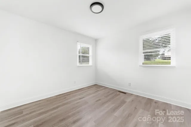 a view of a backyard with swimming pool