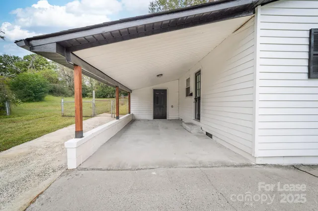 a view of a kitchen with wooden floor and a kitchen