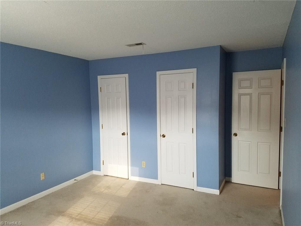 4917 B Tower Road Greensboro, NC 27410 - Photo 5 of 8 The Master Bedroom has upgraded carpet and padding. Two closets and attached private bath.