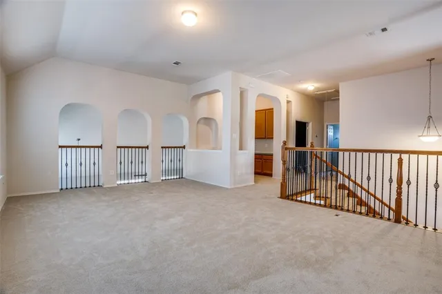 a view of a hallway with a livingroom